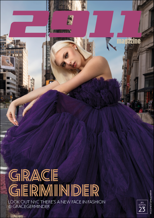 Fashion magazine cover featuring a model in a flowing, purple dress with an urban city background.