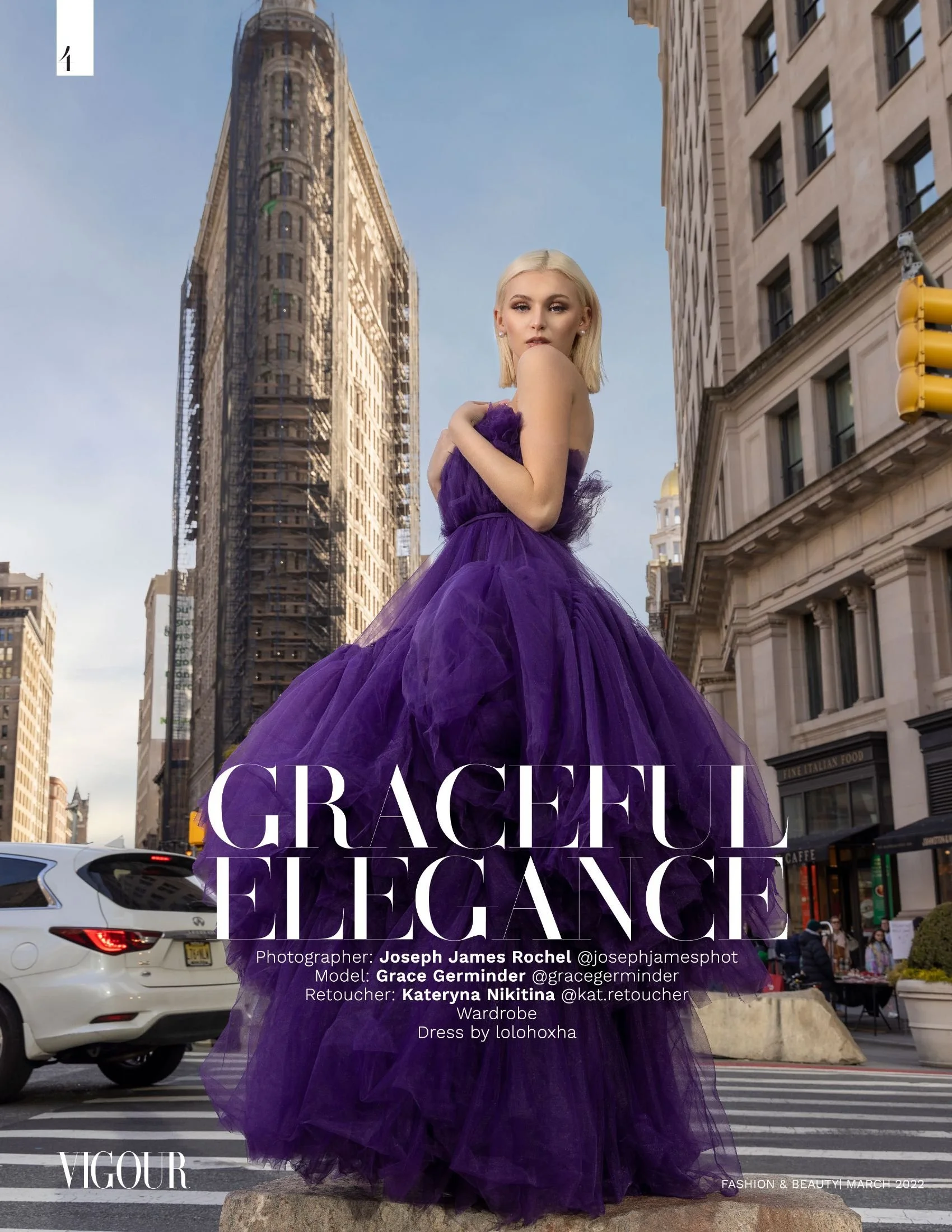 Model in purple dress posing on city street with Flatiron Building in background