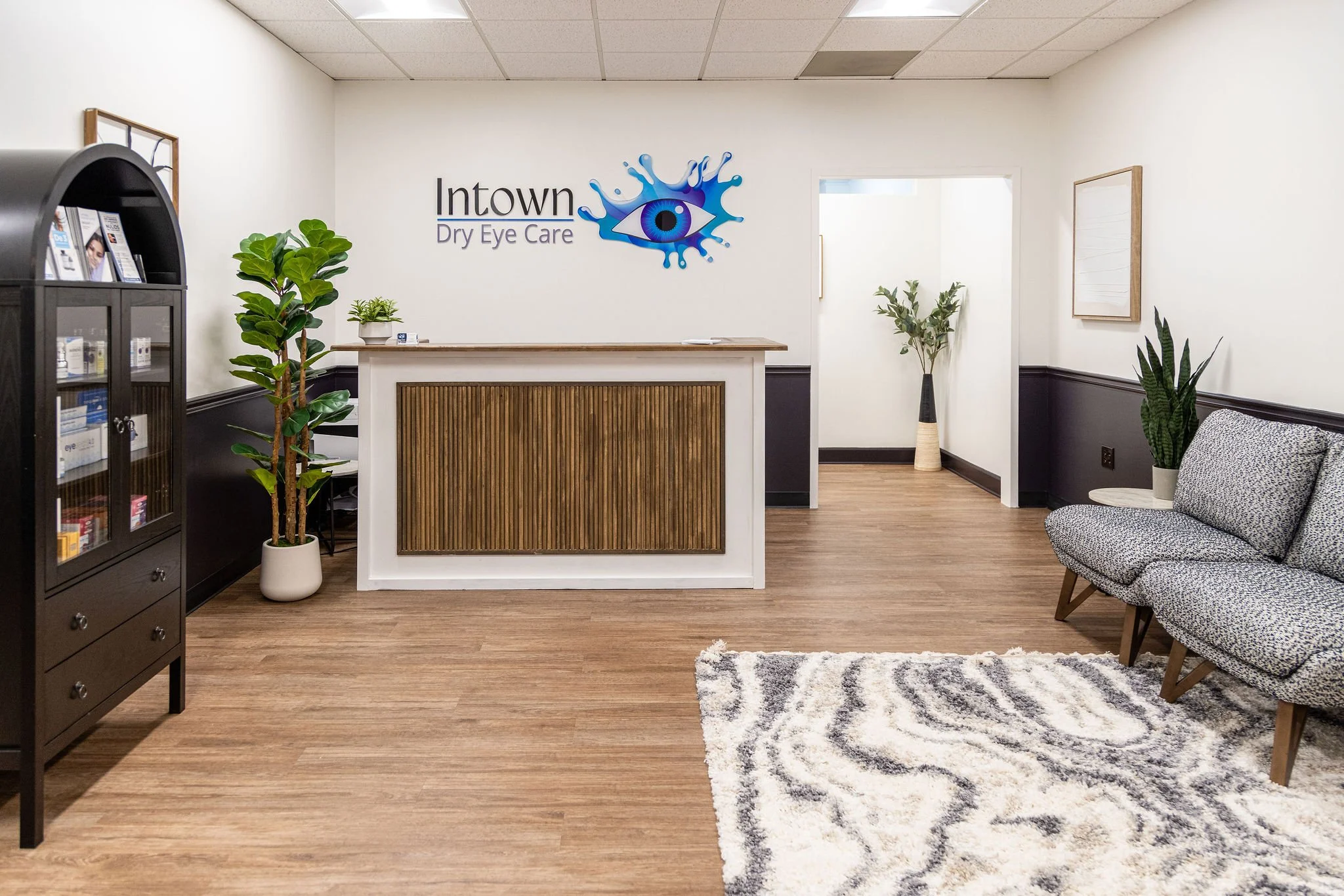 Modern lobby inside Intown Dry Eye Care in Decatur, GA featuring the clinic logo and welcoming patient-focused environment serving the Atlanta area.