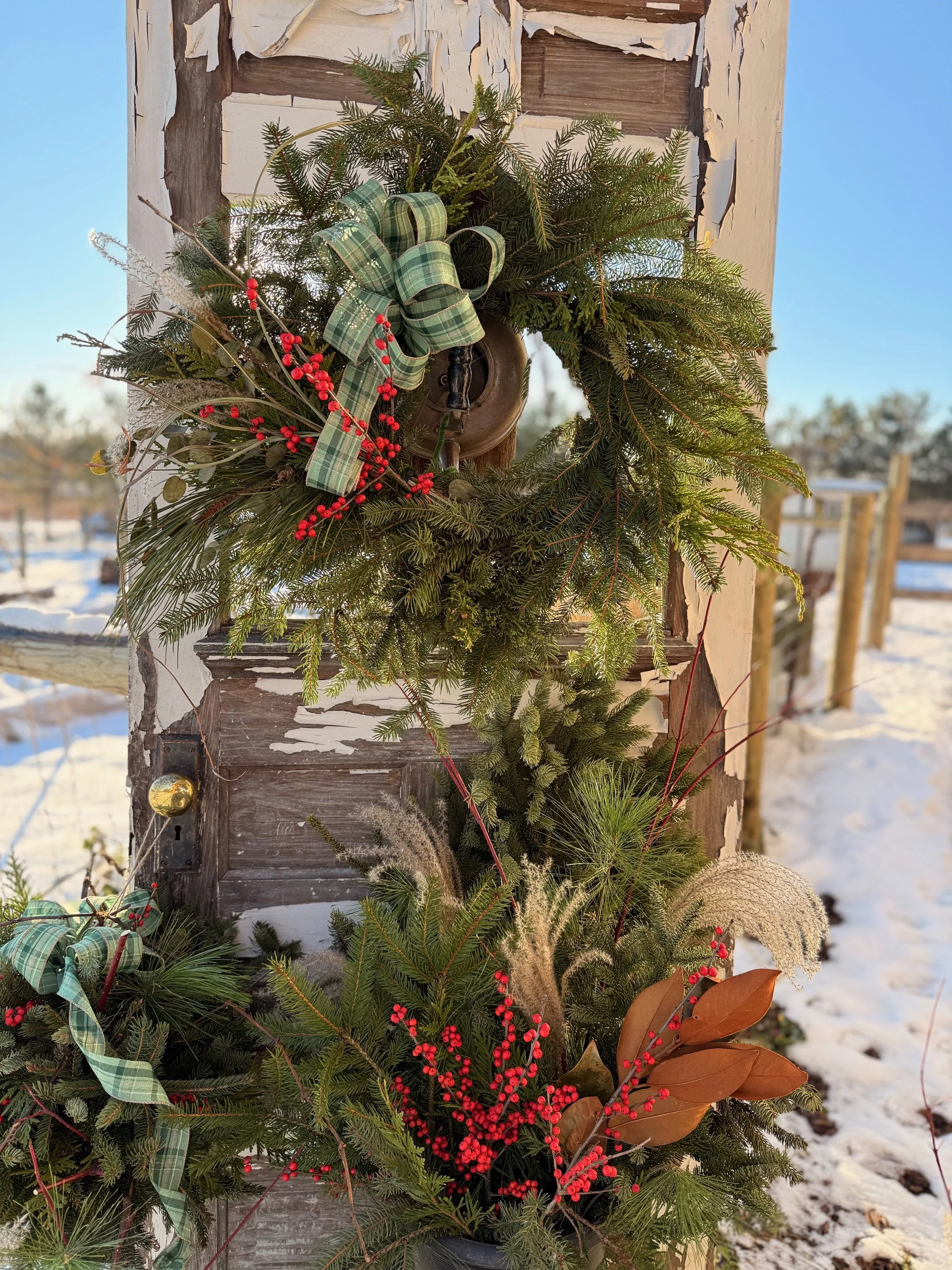 Coordinated holiday wreath and porch pots