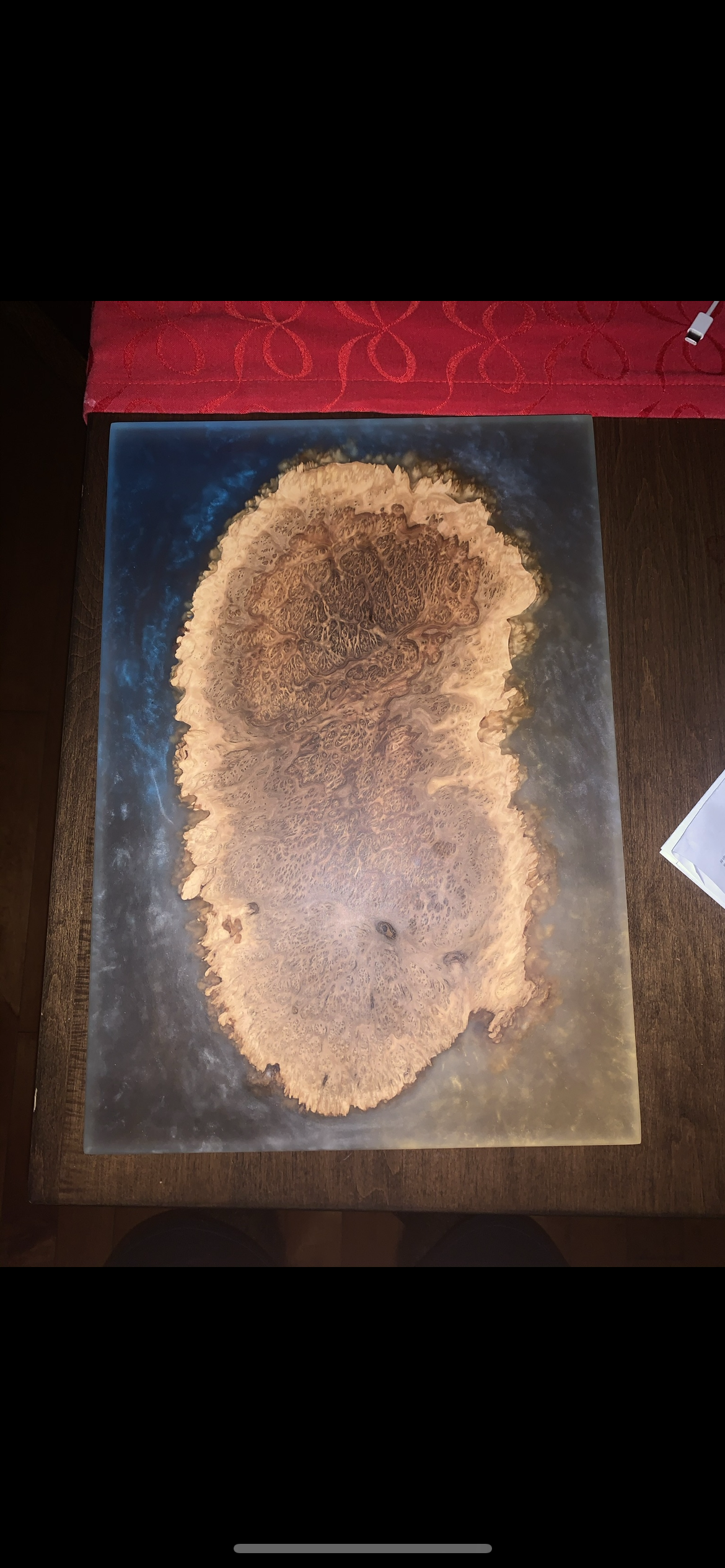 Epoxy resin and wood art piece resembling an island on a tabletop