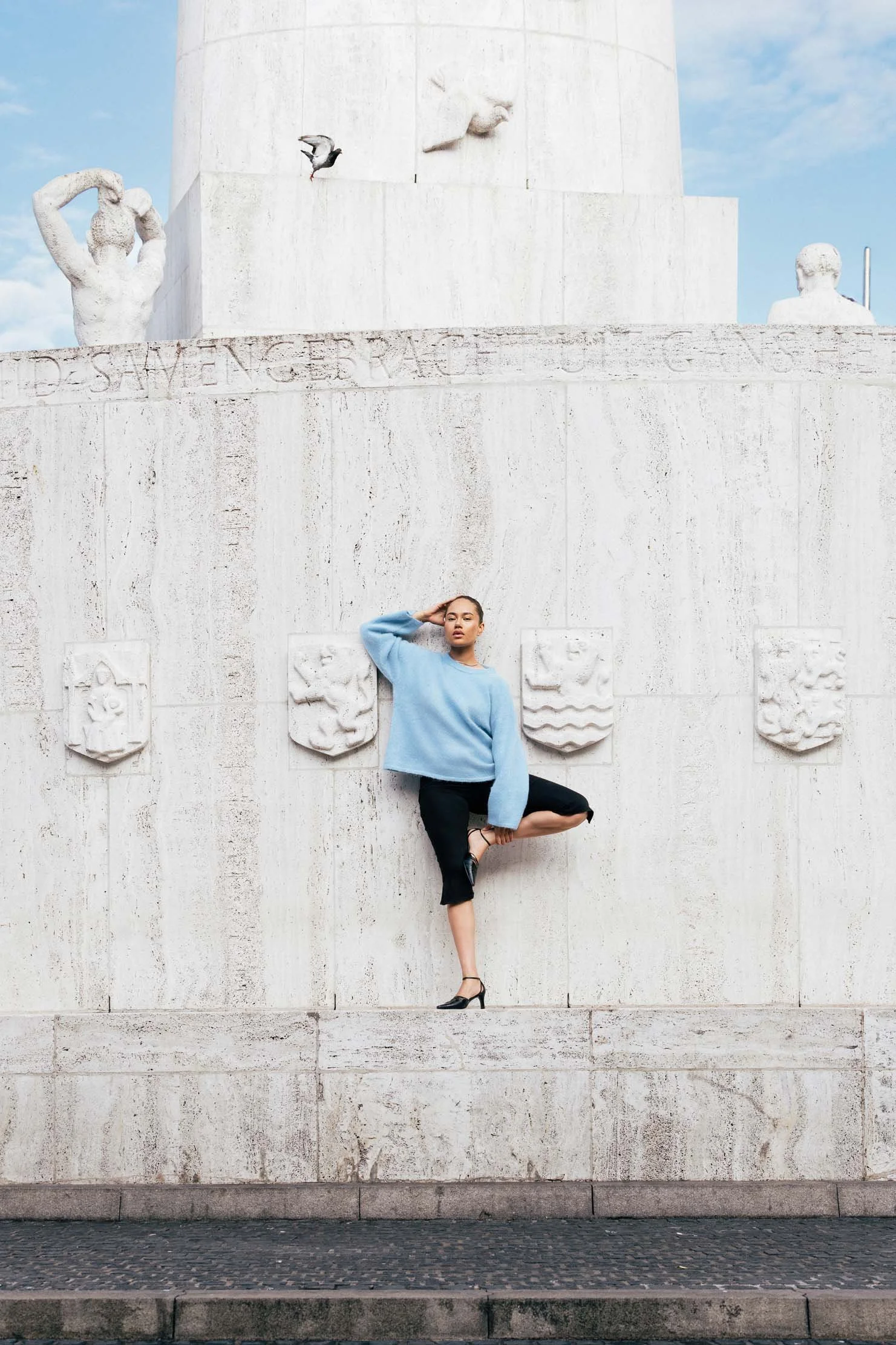 wide-angle-fashion-editorial-stone-monument-european-city.jpg