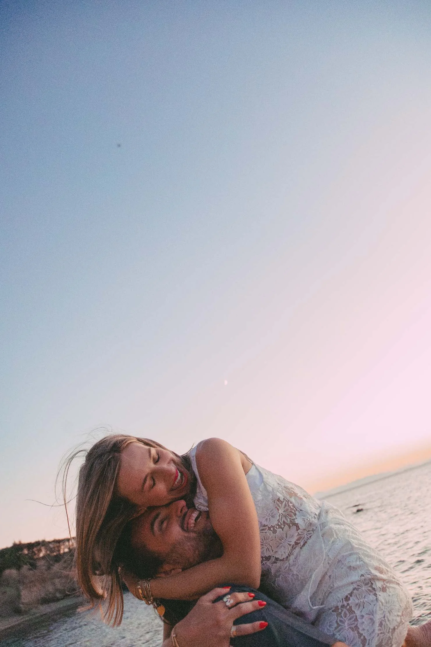 piggyback-sunset-engagement-photos-greek-coast.jpg