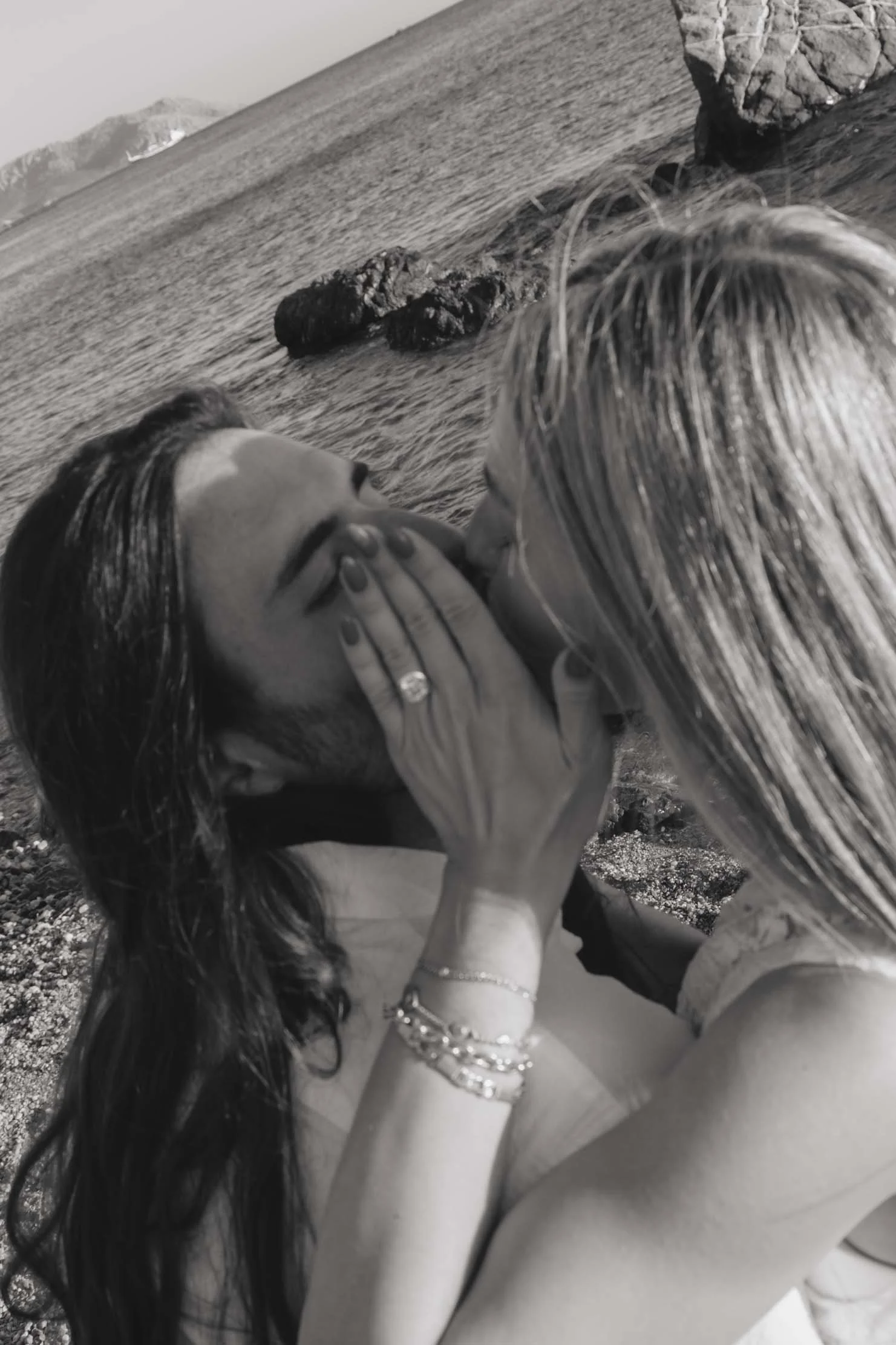 black-and-white-engagement-portrait-hands-on-face-greece.jpg