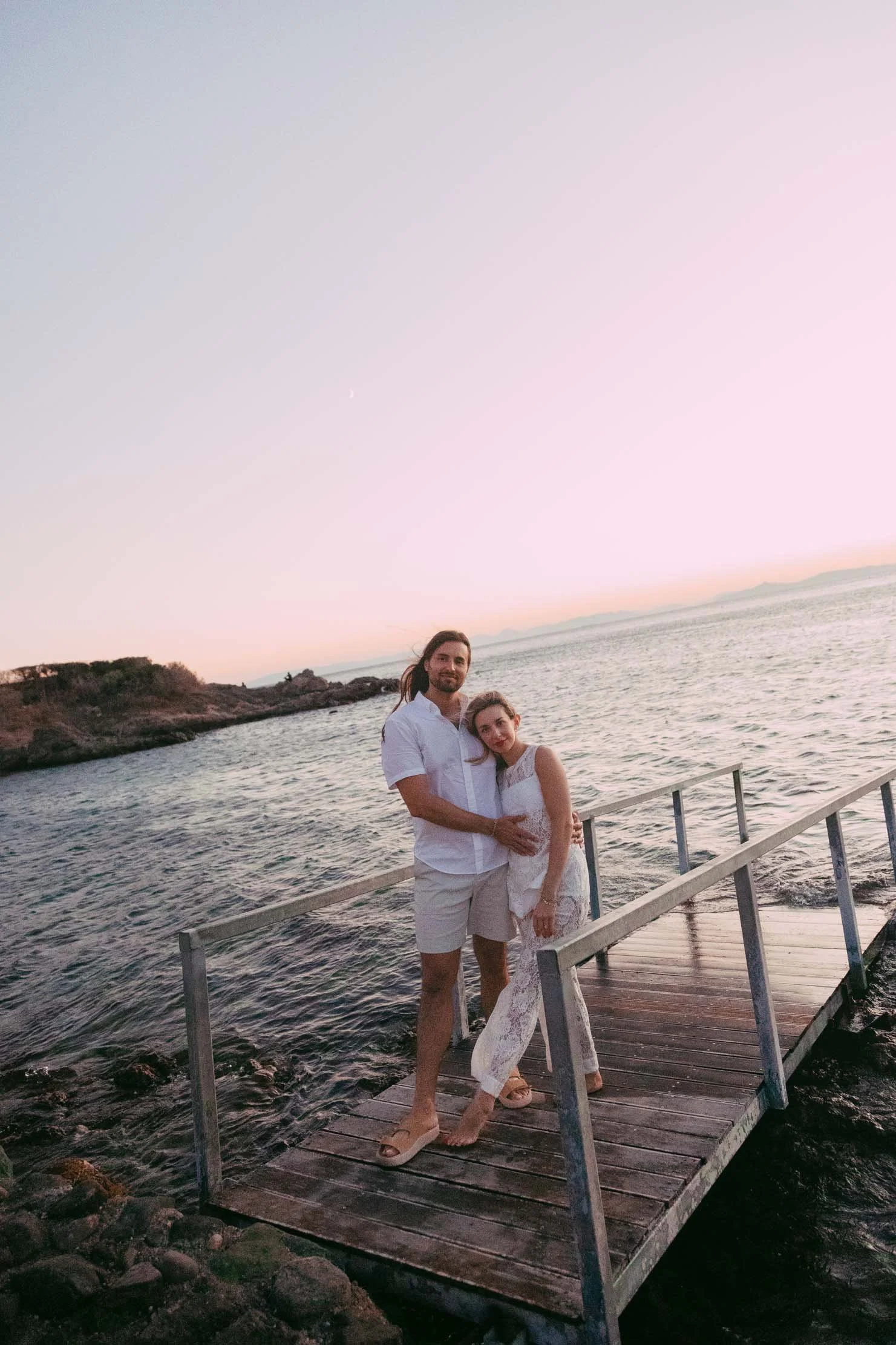 couple-on-dock-pink-sunset-athenian-riviera-cheyenne-arnold.jpg