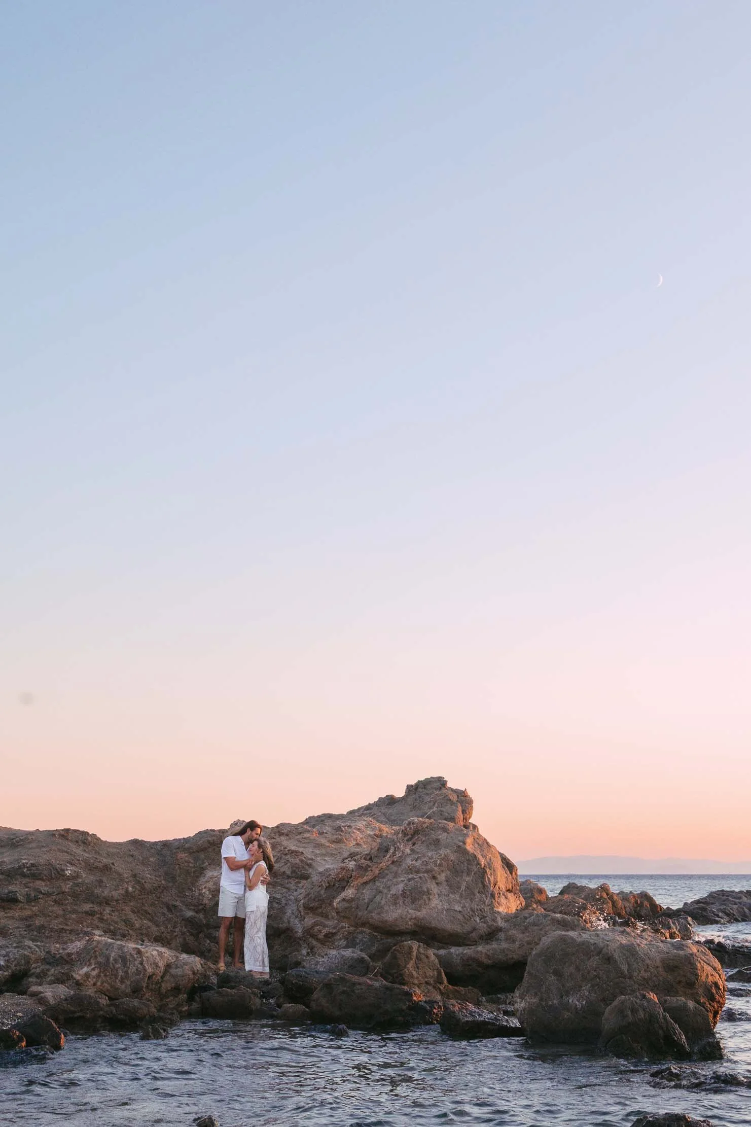 wide-sunset-engagement-portrait-greek-coastline.jpg