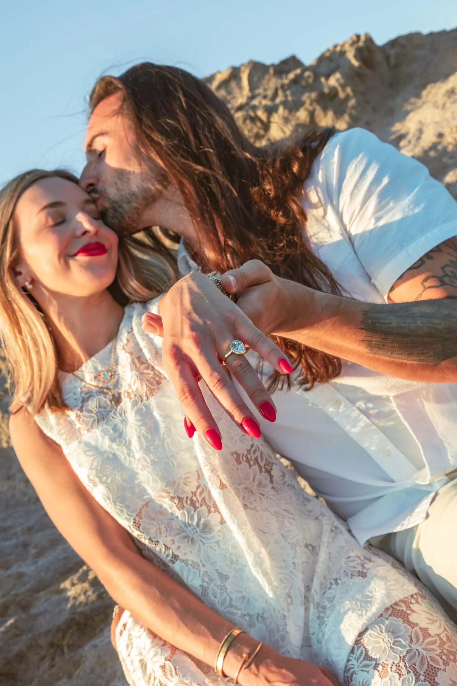 kiss-on-cheek-engagement-ring-greece-proposal-photographer.jpg