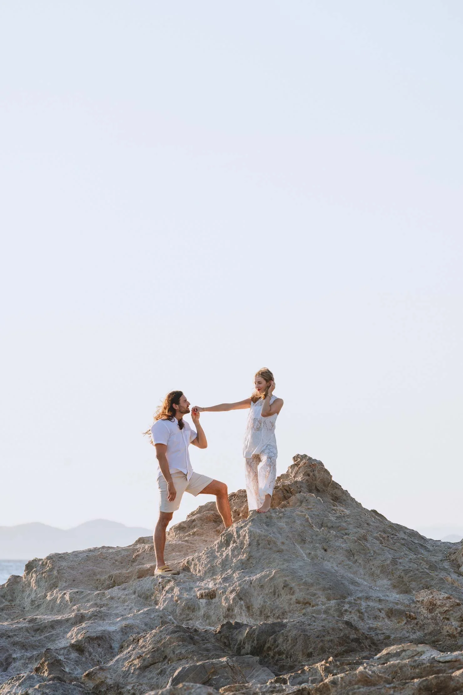 couple-on-coastal-rocks-athenian-riviera-engagement.jpg