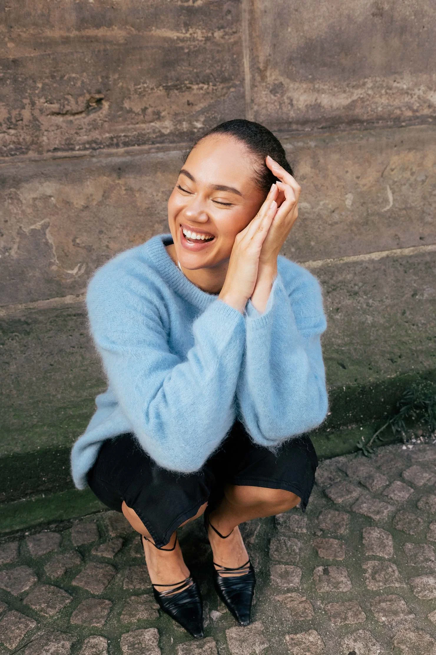 candid-fashion-editorial-laughing-blue-sweater-europe.jpg
