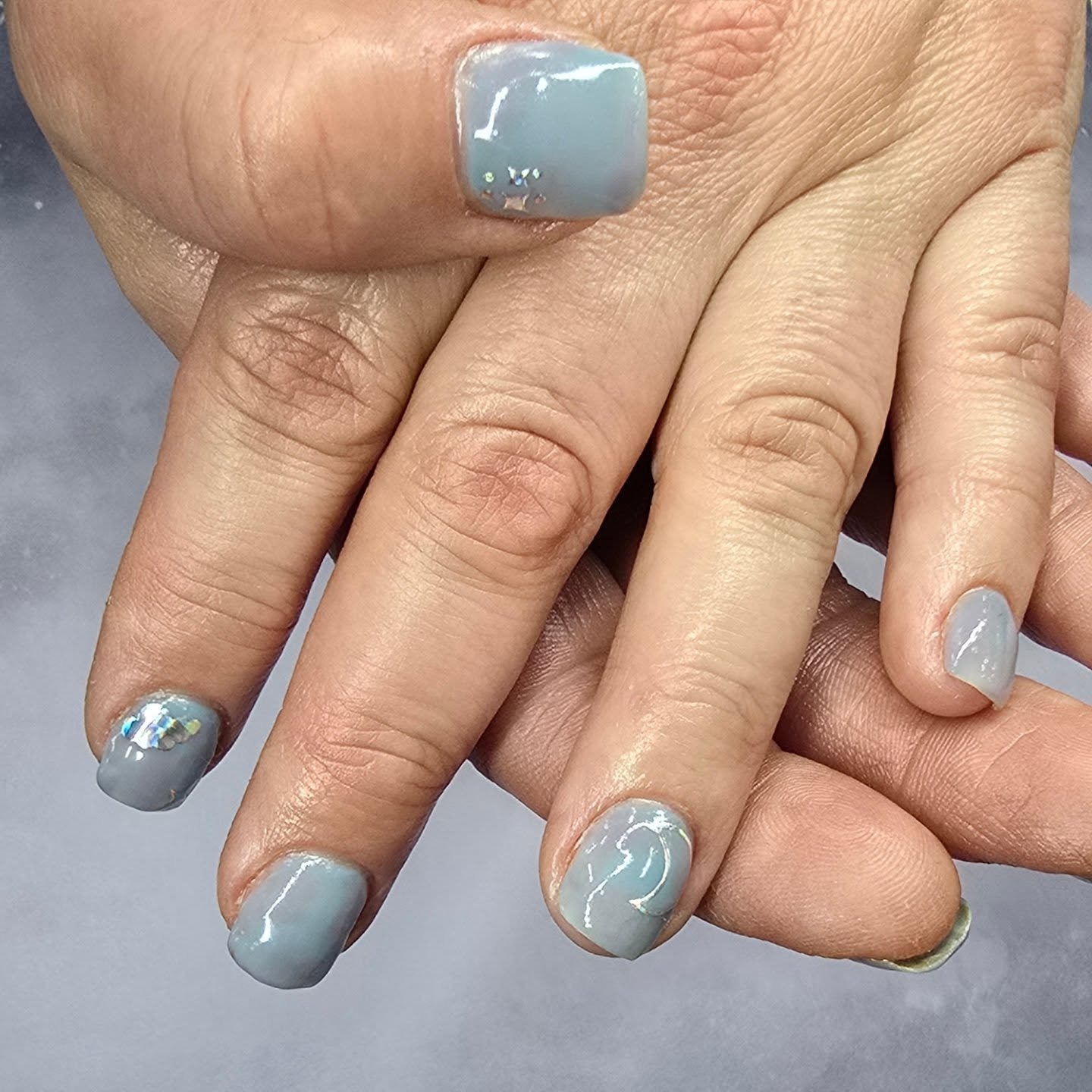 We made a cute little blue and purple cloudy sky type of nails. She got a short full set for $45 and $10 nail art. Just adorable.