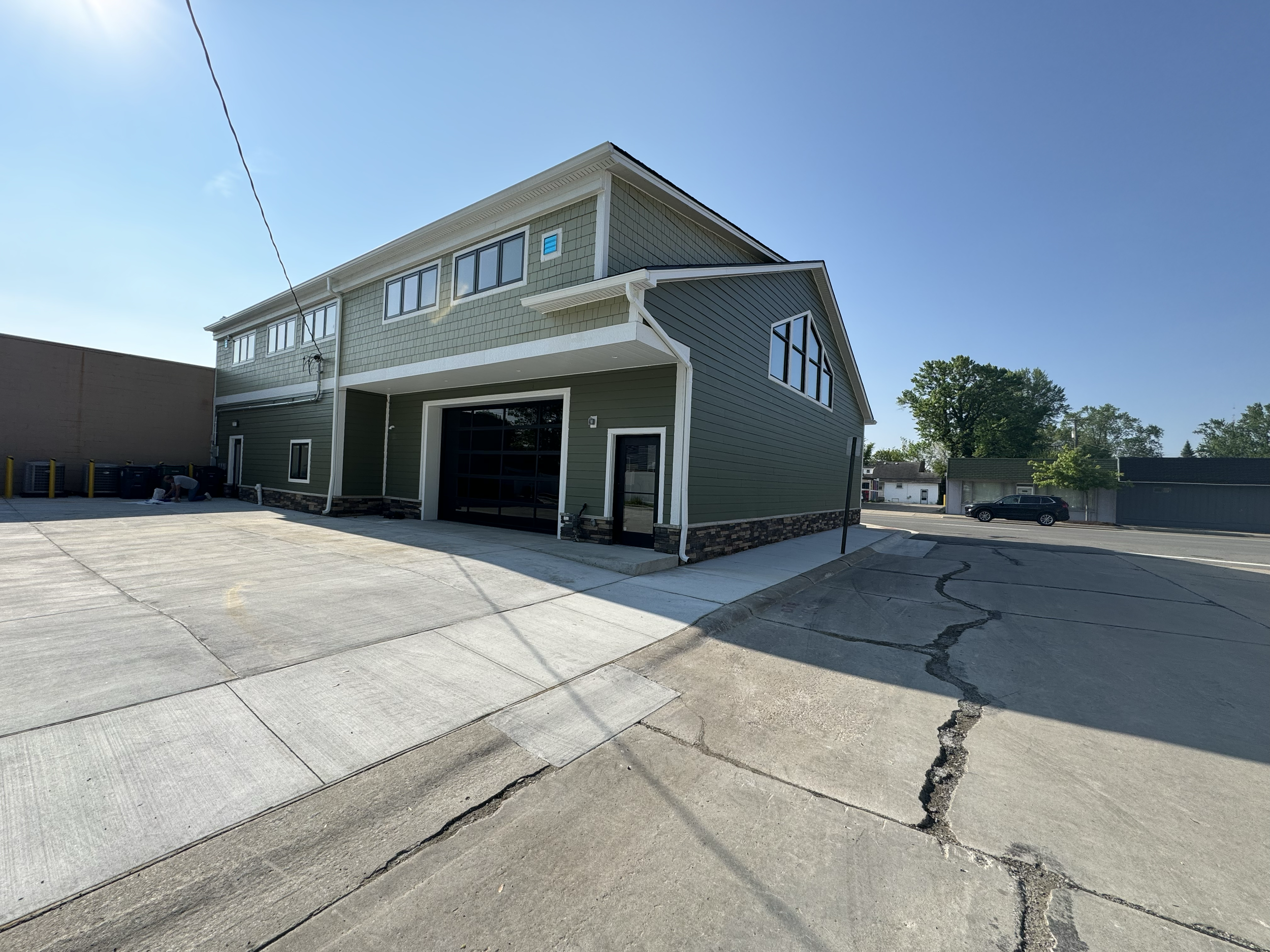 Full-service commercial construction project in Berkley, MI — slab work, steel structure, and large-scale window installation by Motor City Construction.