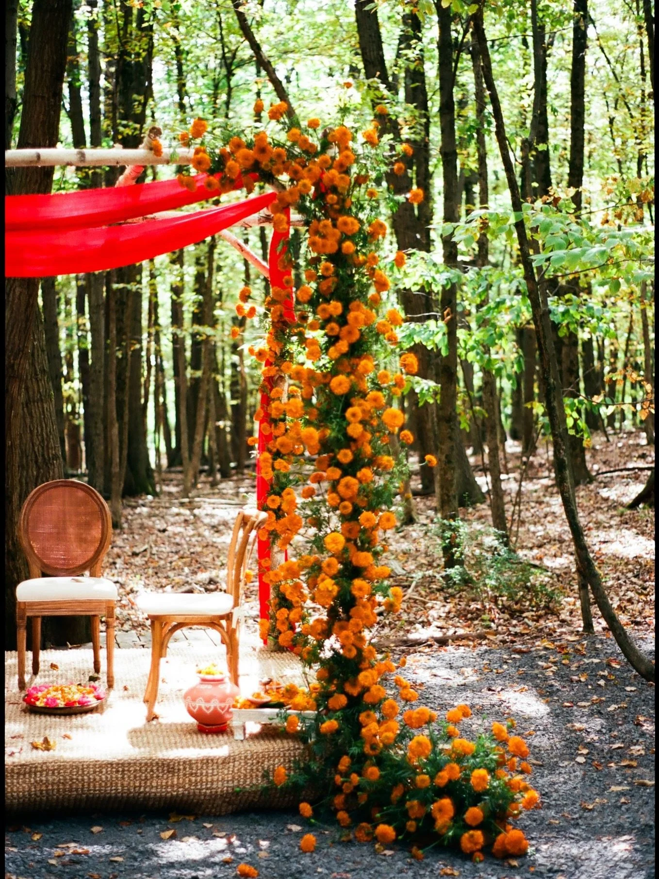 A ruby-red fabric from a family trip to India added a personal touch to the mandap, draping softly to catch the breeze. Simple marigolds in bold orange made a powerful statement, letting light, movement, and color create a ceremony that felt personal