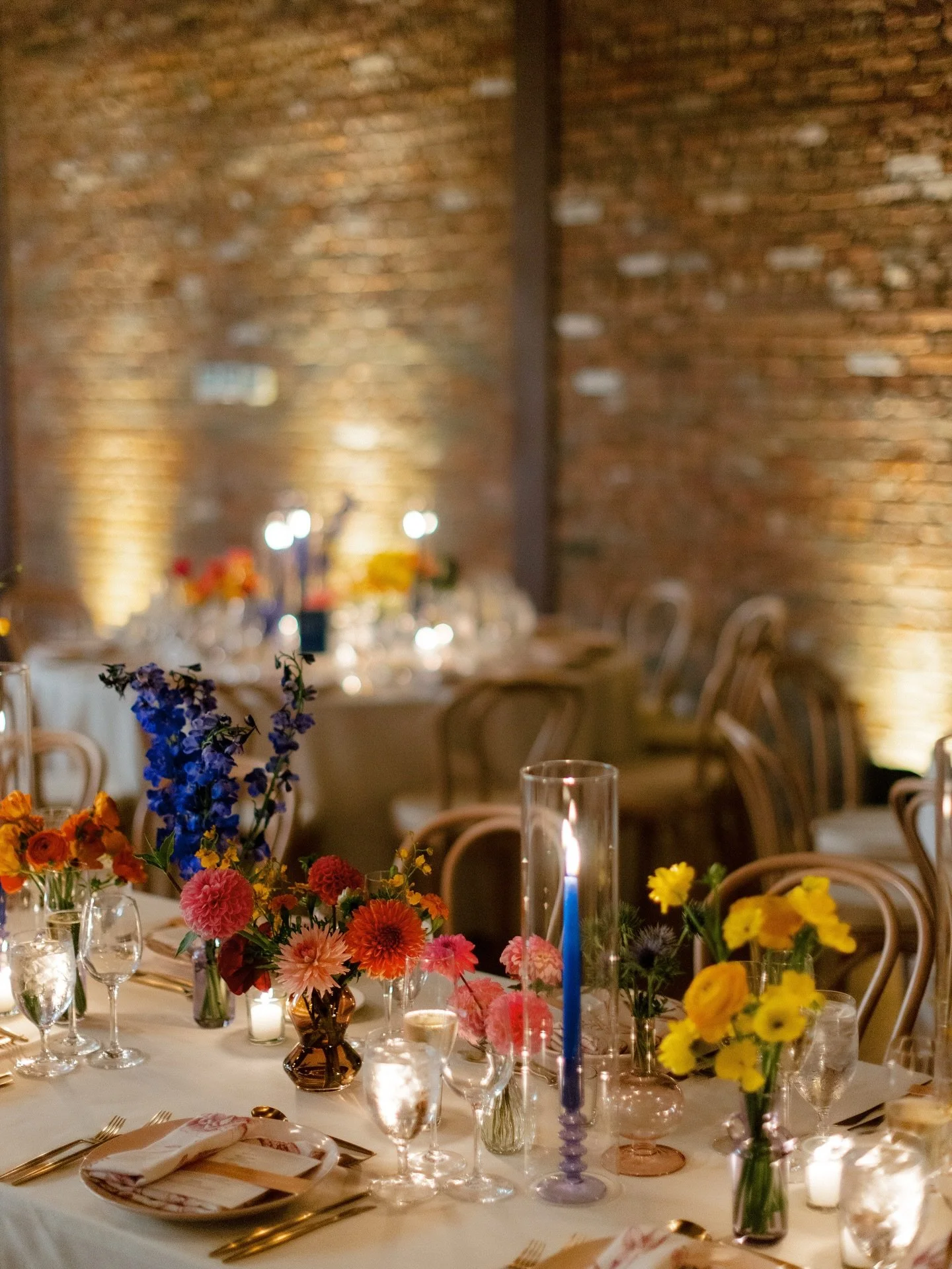 Colored glass vases, candles, and holders carried the vibrant palette through the details, bringing the florals and tabletop elements together in a seamless, lively composition.

Couple: Jolie &amp; Alex
Planning: @veronicajoyevents
Venue/Wedding Cak