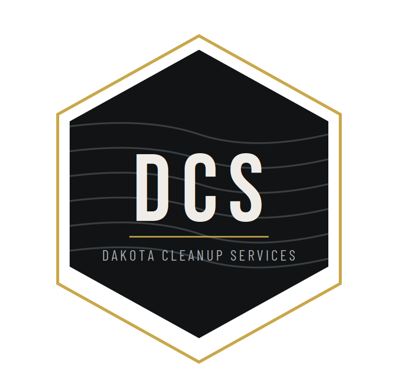 Logo for Dakota Cleanup Services featuring the initials 'DCS' inside a black hexagon with gold outline and white lettering.