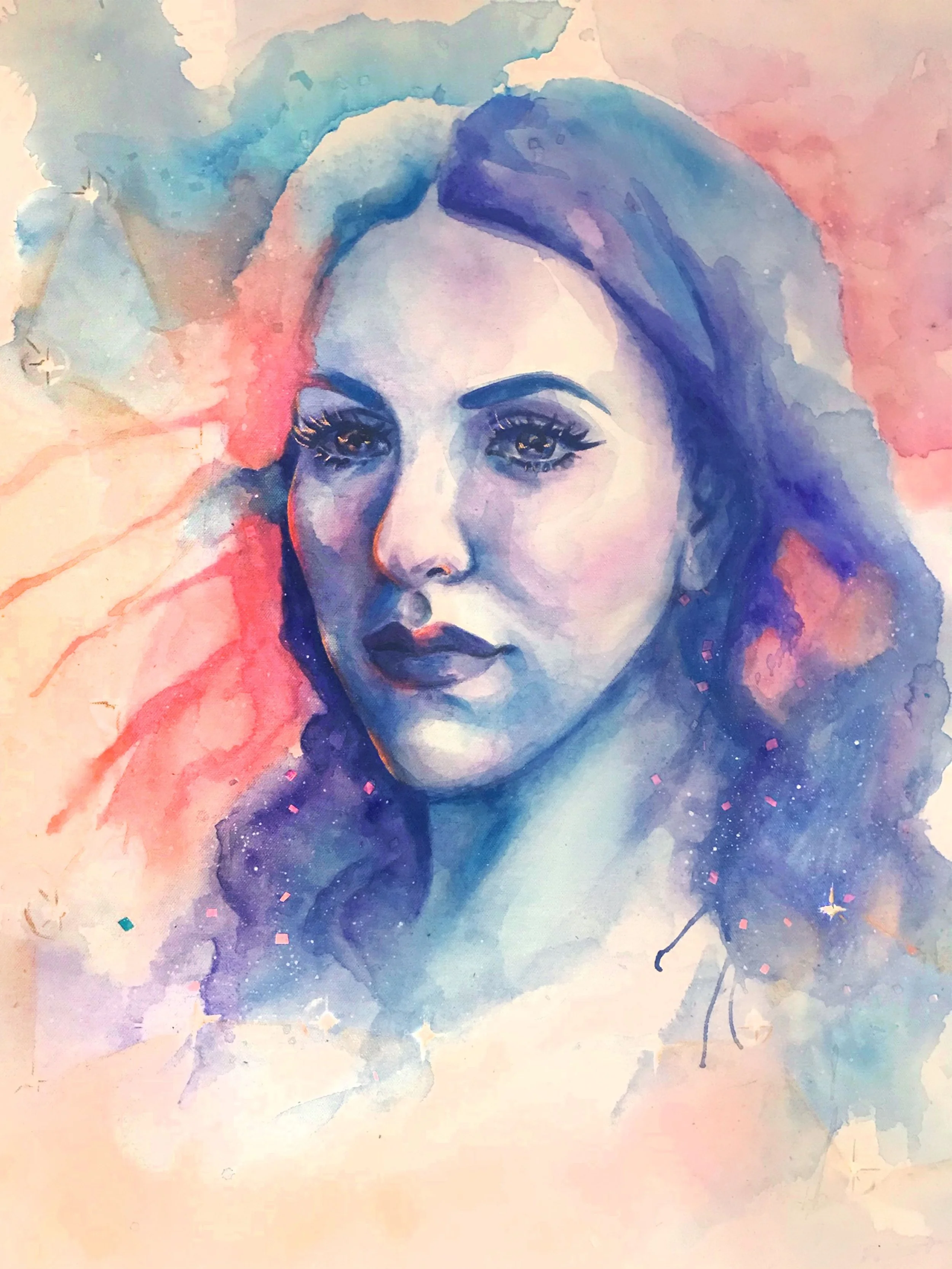 Muse&Flow Miami Art Services Commission Artist Patricia Machin book an artist A watercolor portrait of a woman's face with blue and pink hues, large eyes, and flowing hair