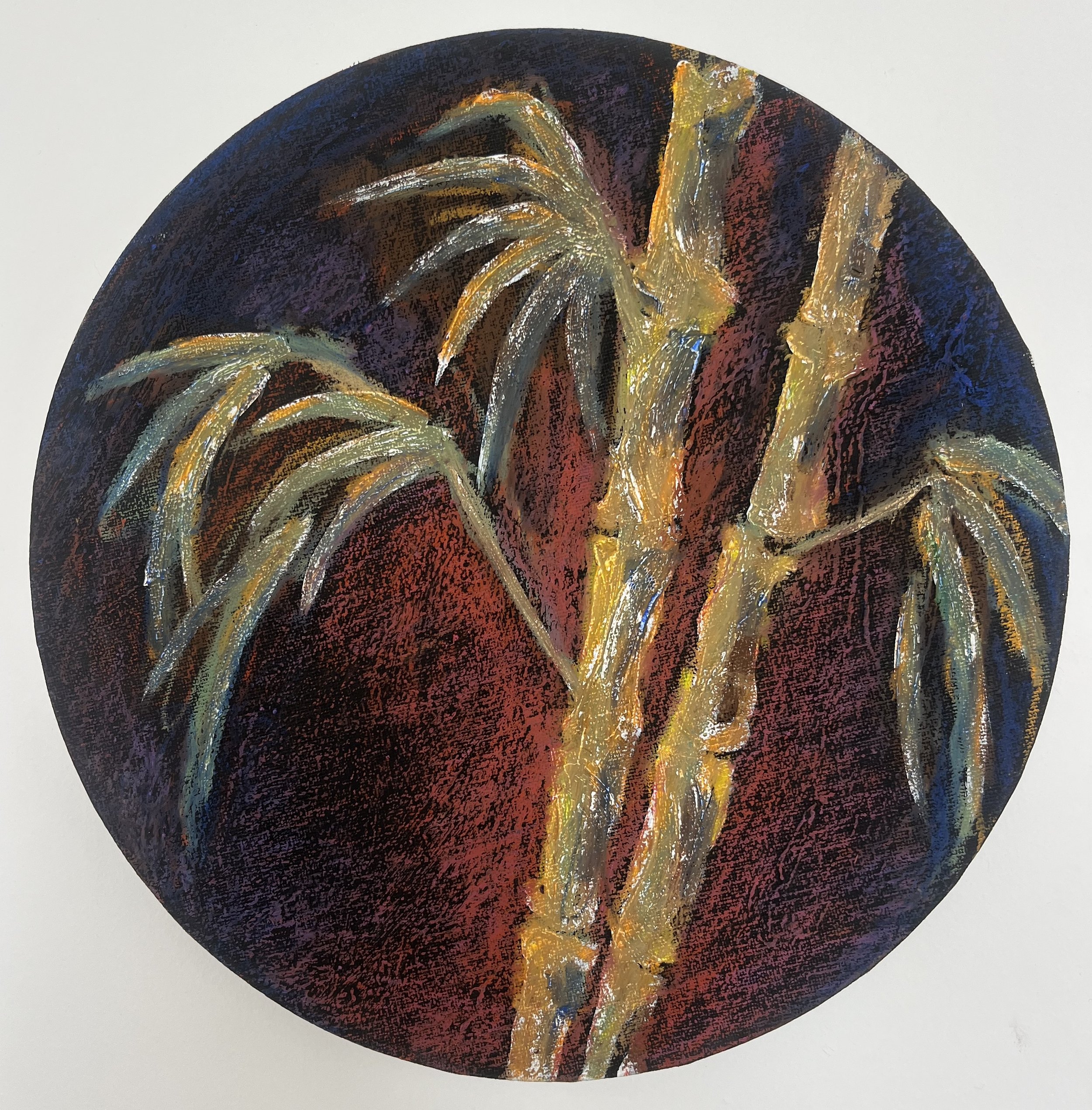 Muse&Flow Miami Art Services Commission Artist Patricia Machin book an artist A circular bamboo pastel painting with dark blue, black, and red background, featuring sweeping strokes of yellow, white, and metallic silver paint.