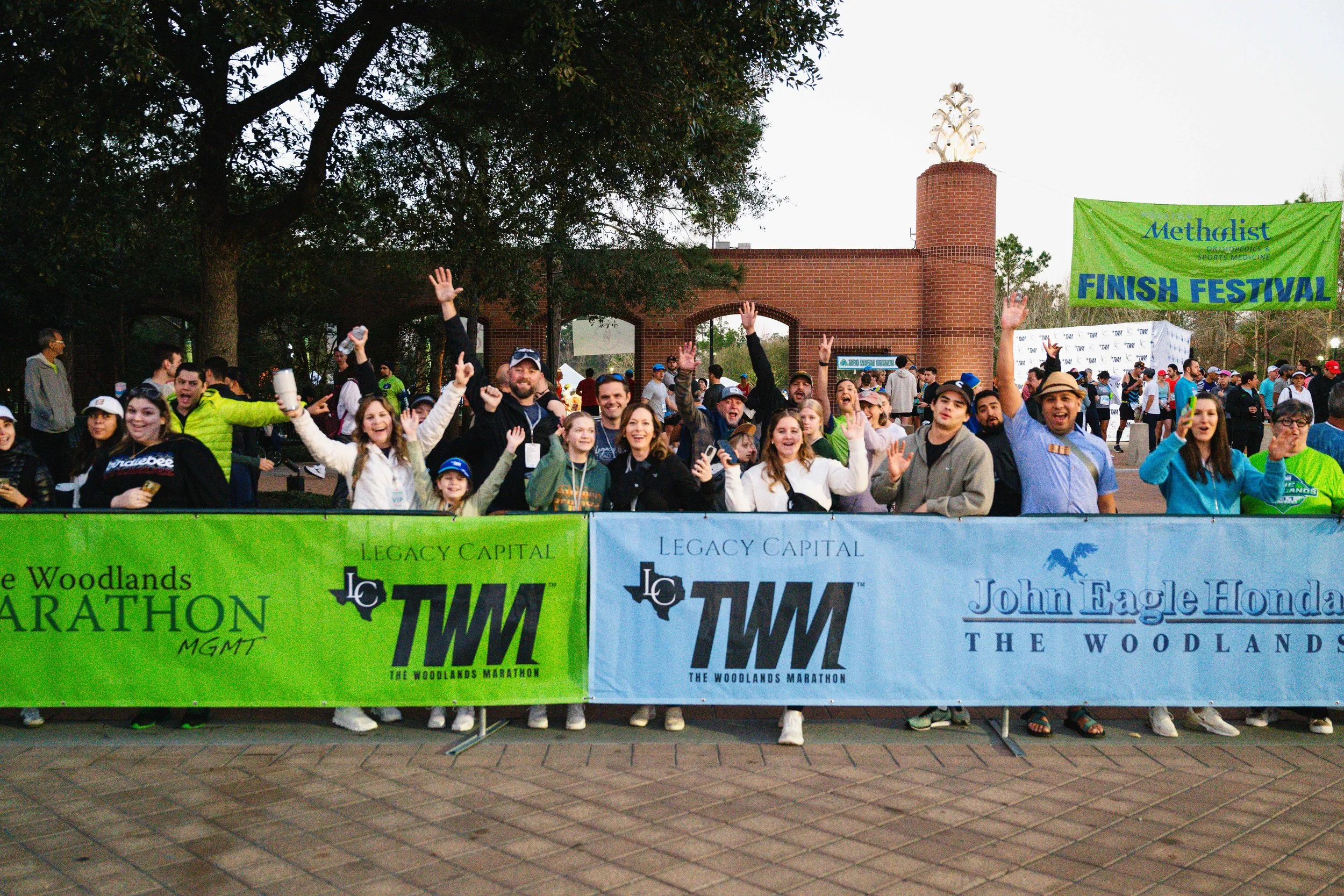 A large finish-festival crowd cheering together