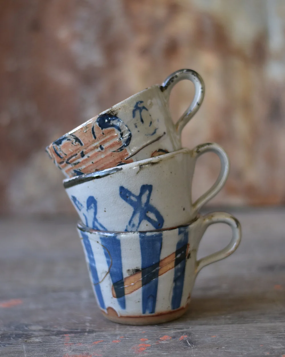 Stacked handmade ceramic cups at Mayfield Studios