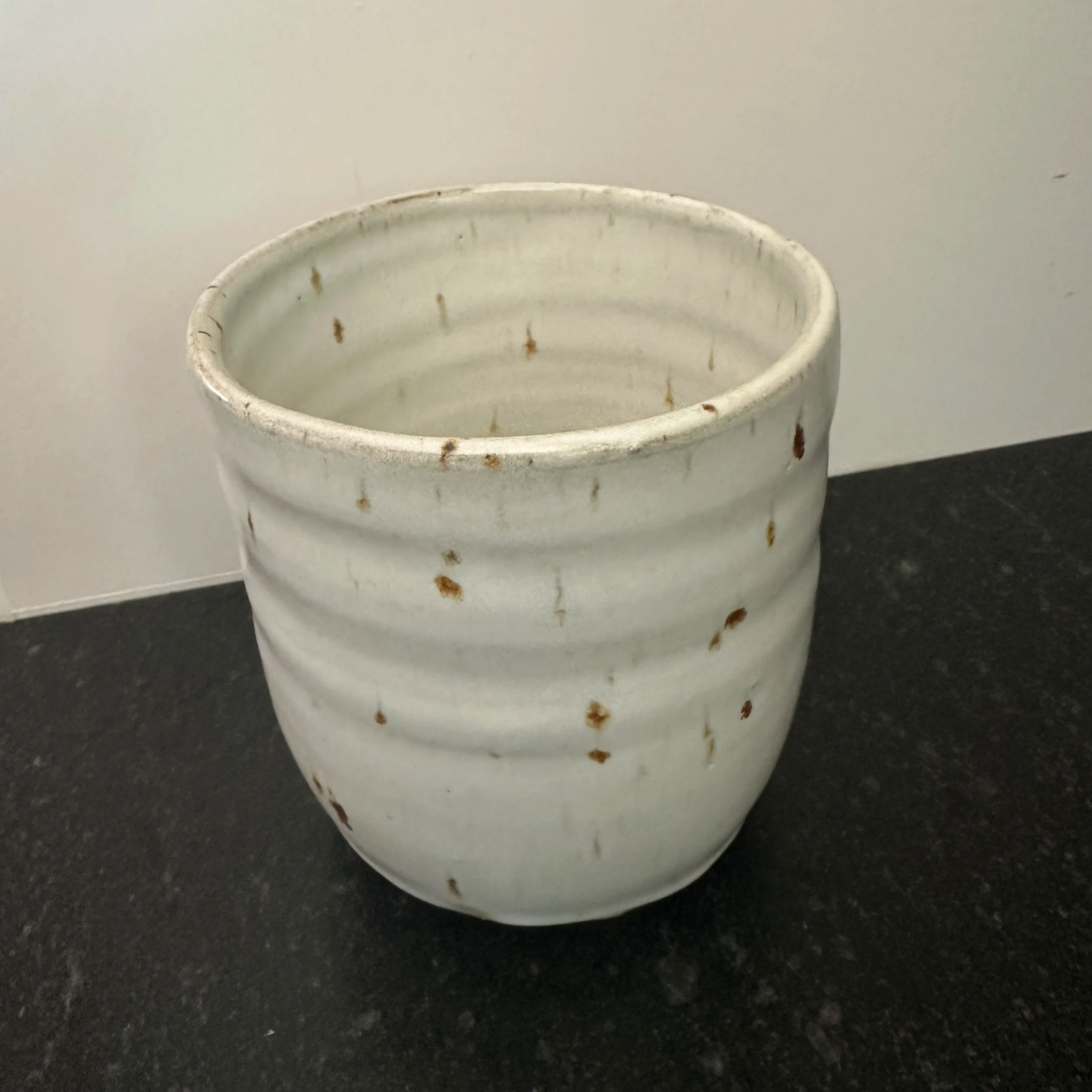 Speckled white cylinder 