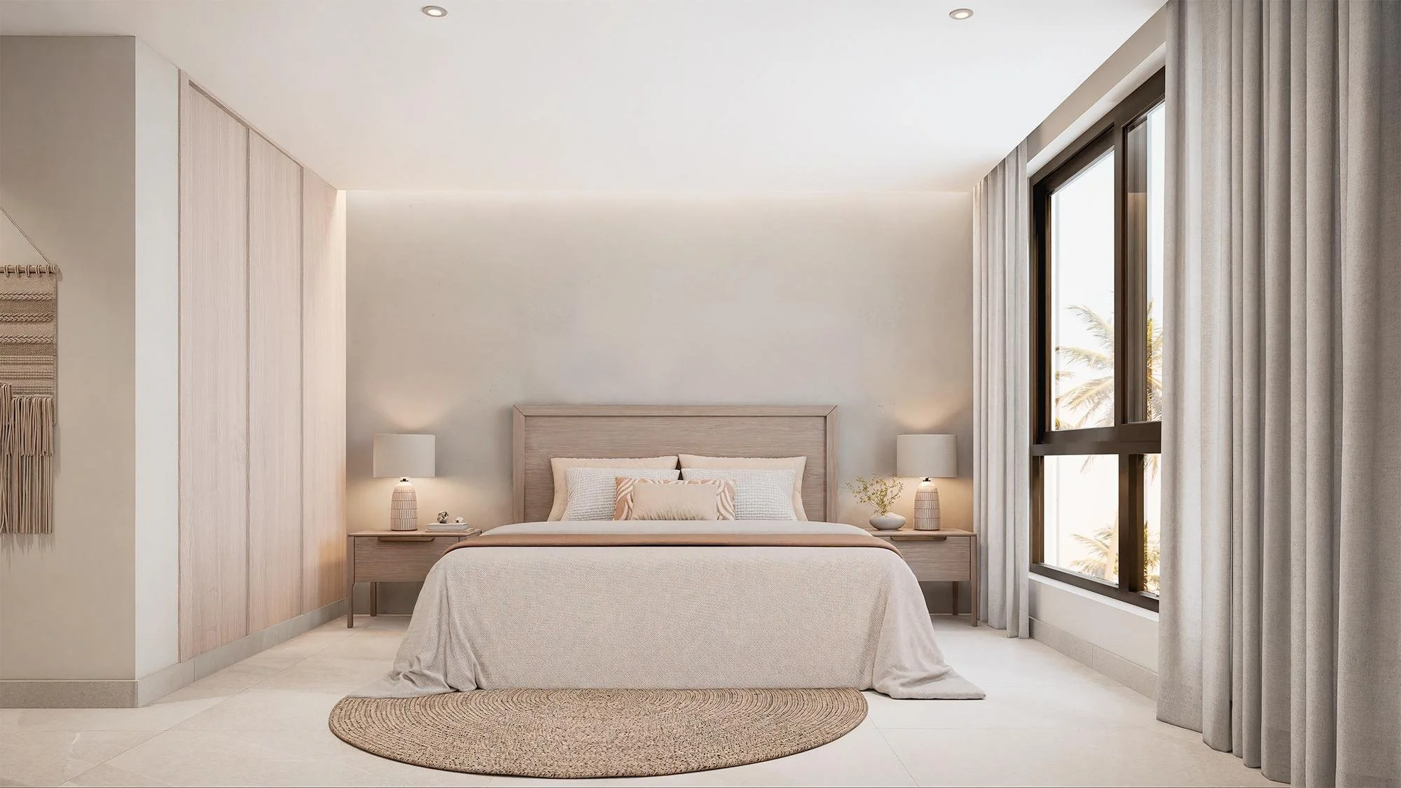 Habitación moderna con cama grande, luz natural, mesas de noche con lámparas, decoración minimalista, y cortinas grises.