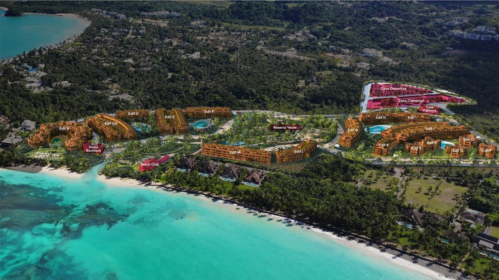 Complejo turístico junto a la playa con edificios residenciales, zonas comerciales y áreas recreativas rodeadas de vegetación en entorno natural.