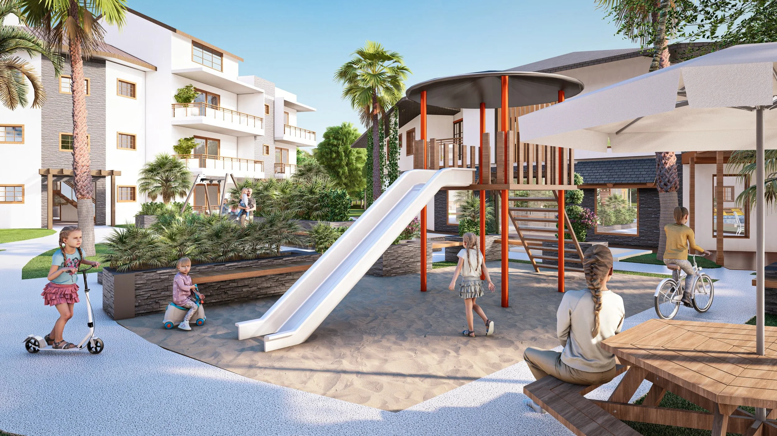 Área de juegos al aire libre con tobogán, niños jugando en scooters, bicicletas, y mesa de picnic; rodeada de edificios y vegetación.