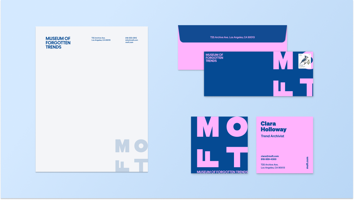 Collection of stationery from the Museum of Forgotten Trends, including letterhead, business card, and envelopes in blue, pink, and white with bold letter designs.
