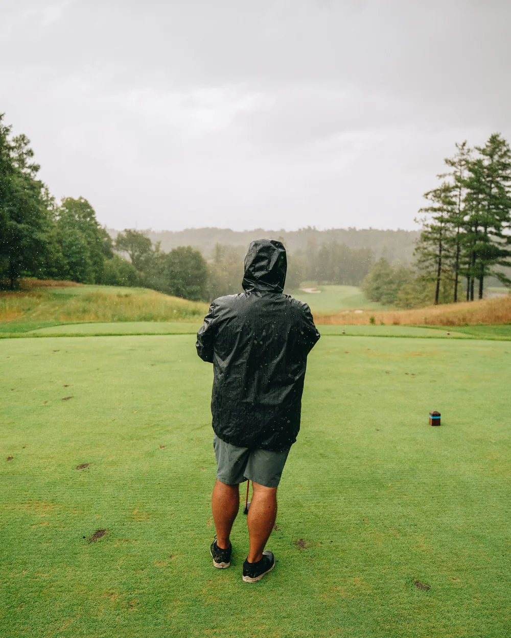 Teeing off in the rain at Copper Creek