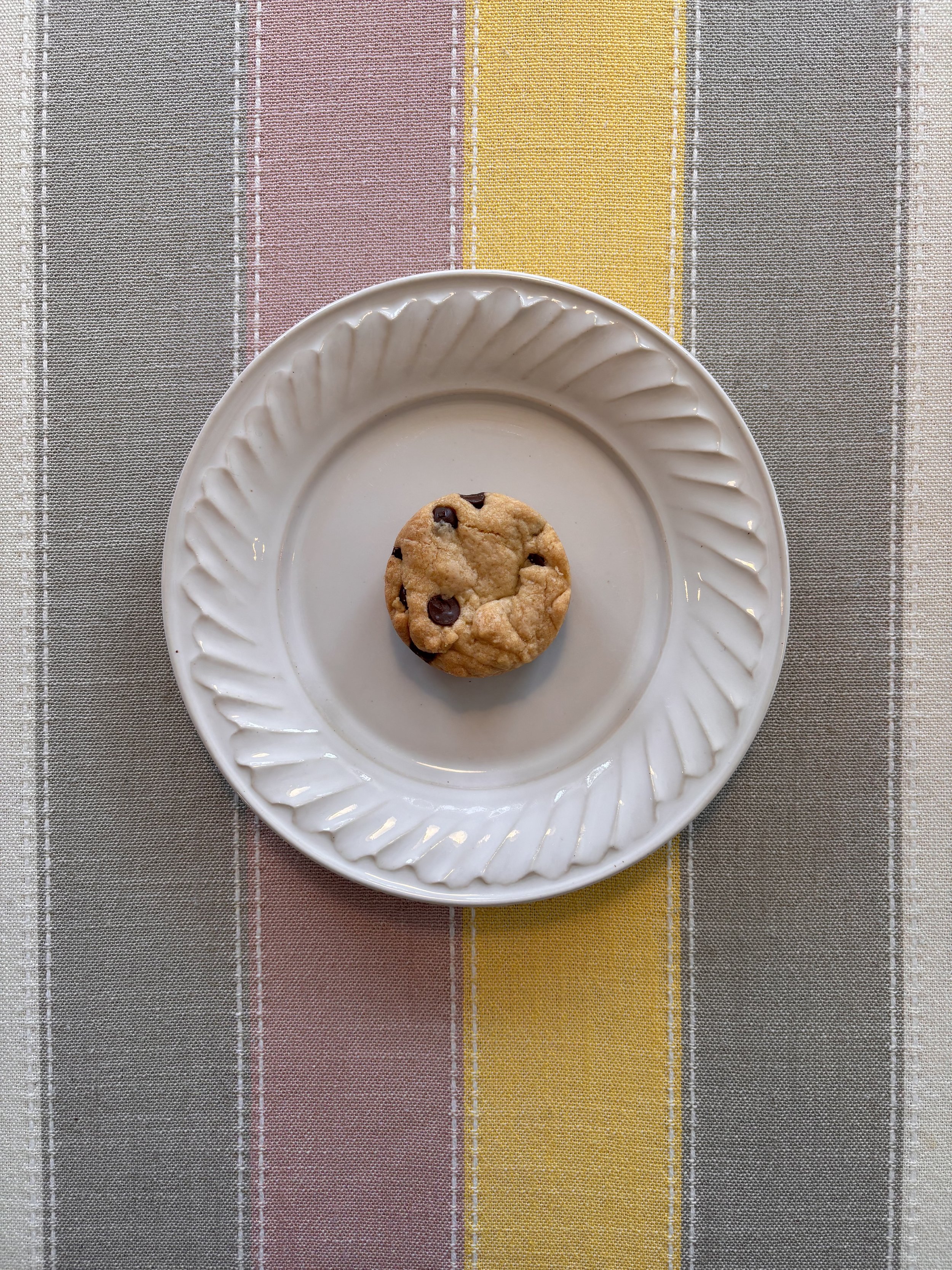 Round blondie on a scalloped plate
