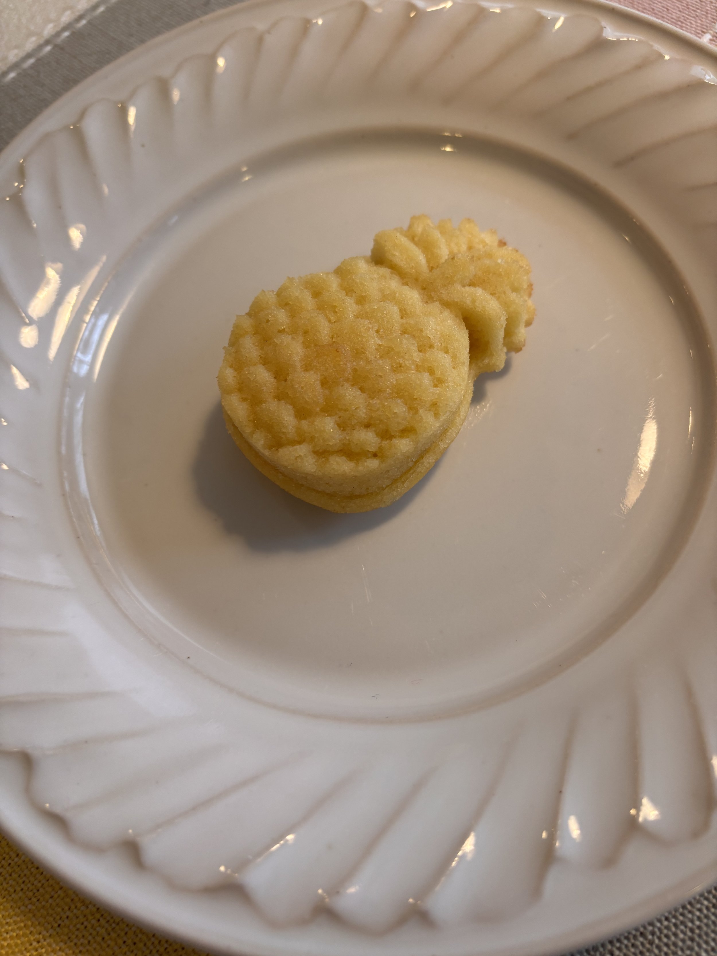 Close-up of mini pineapple-shaped tropical rum cake