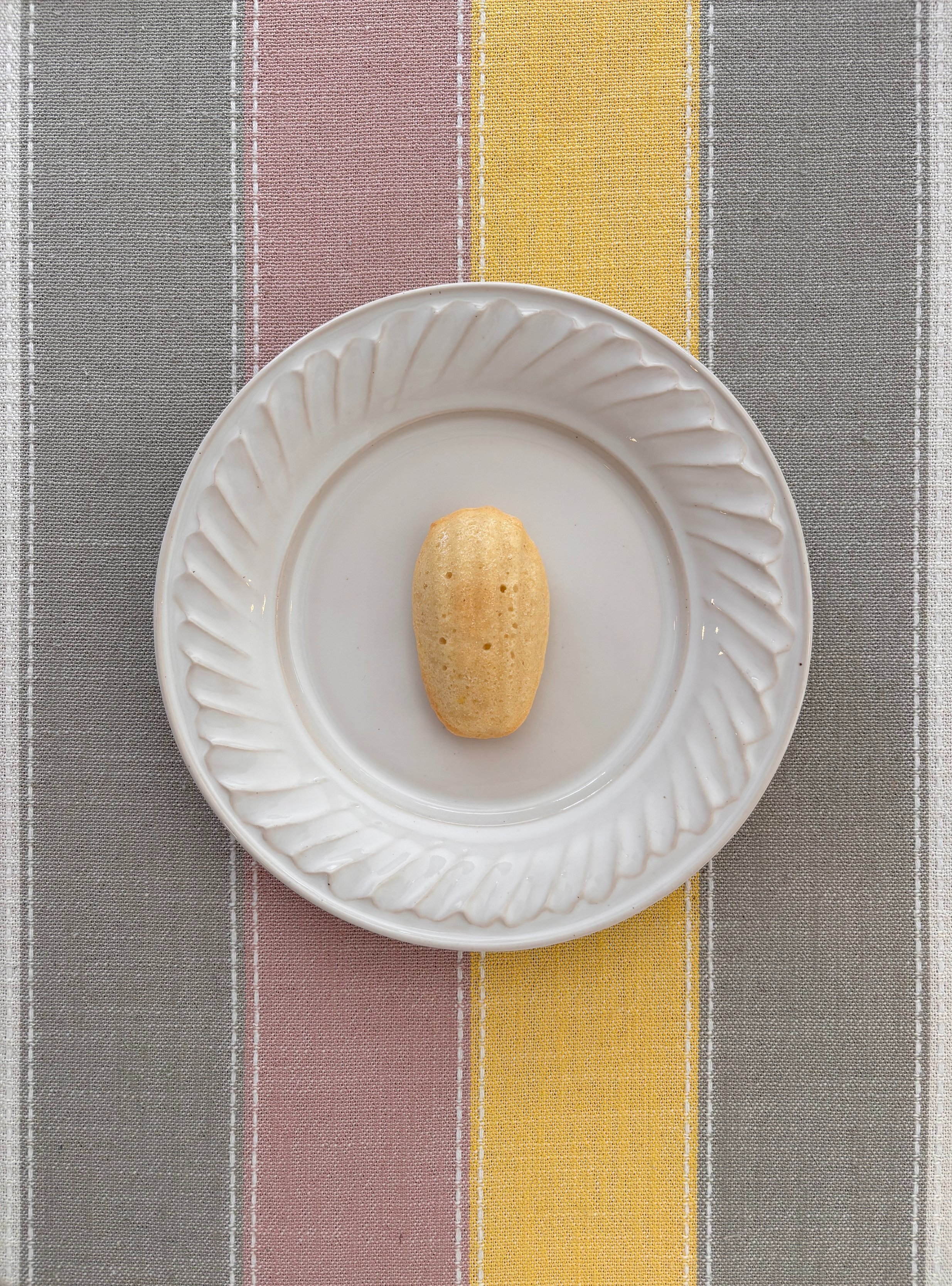 Vanilla madeleine cookie on plate