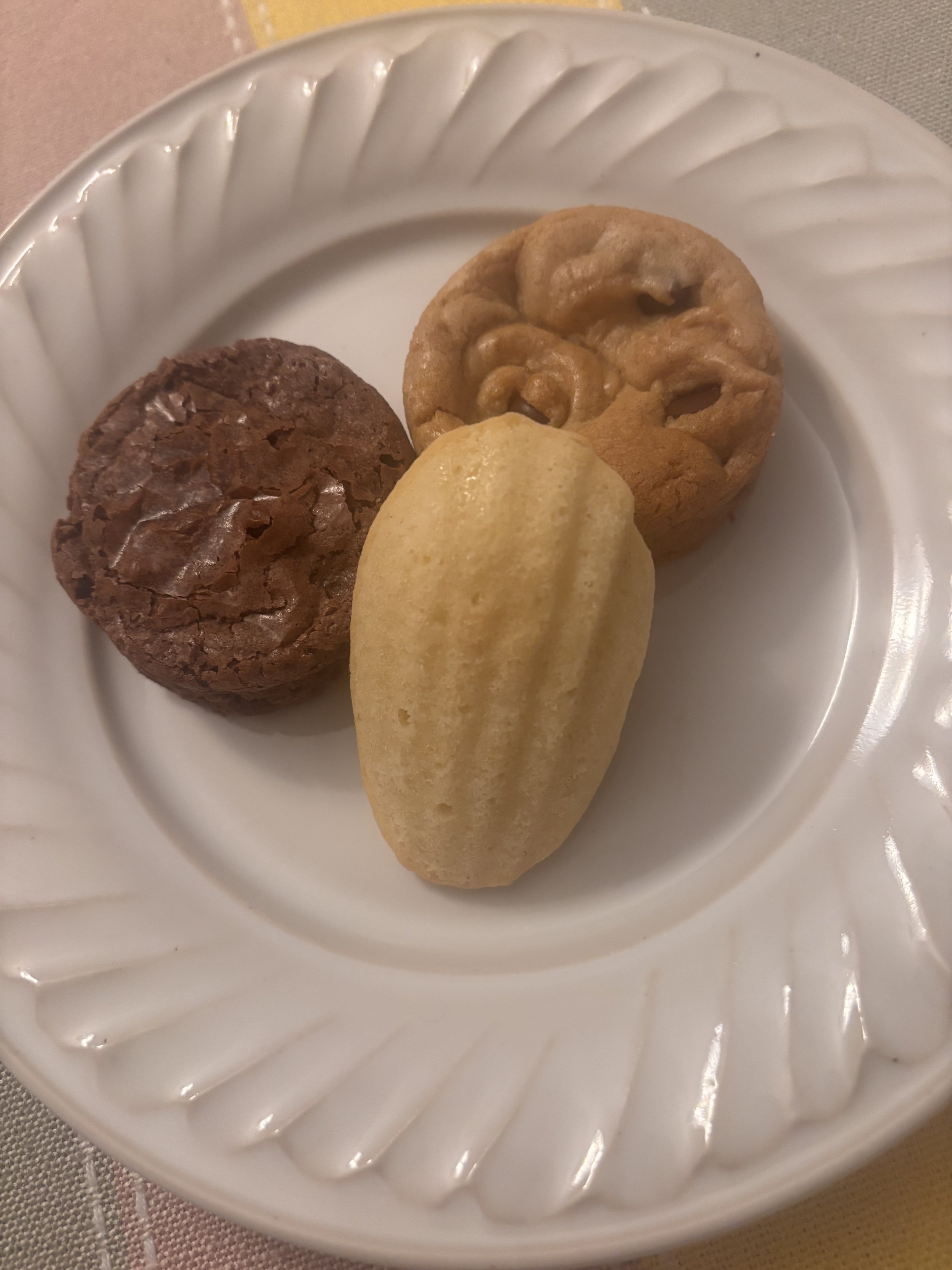 Brownie, blondie and vanilla madeleine on plate