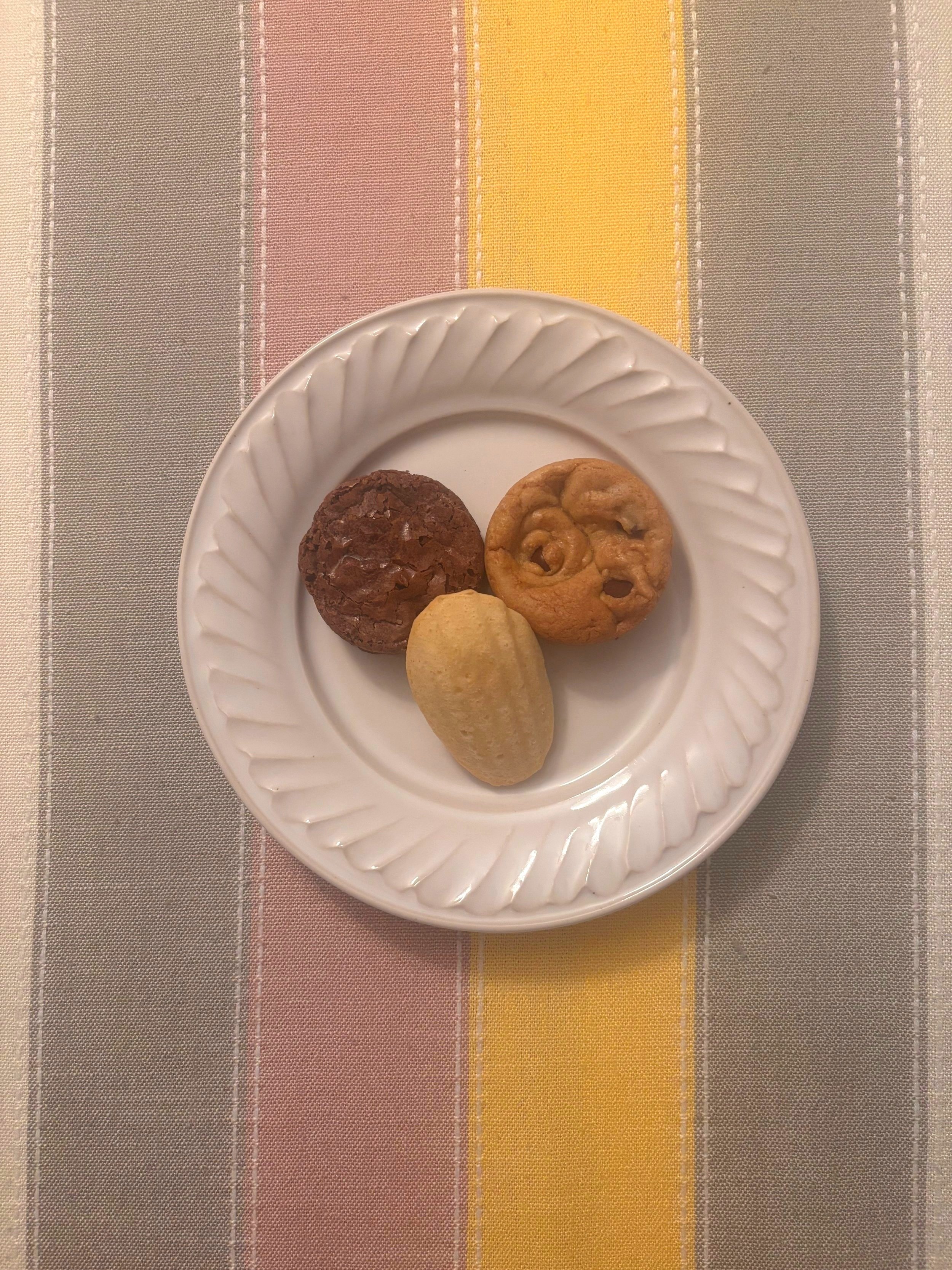 Brownie, blondie and vanilla madeleine on plate