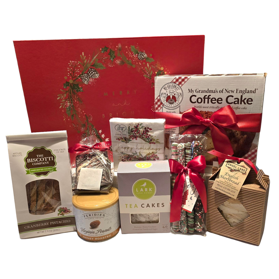 Assorted Christmas gift packages including cookies, tea cakes, a coffee cake, chocolate, and candy decorated with red ribbons, with a holiday-themed red box in the background.