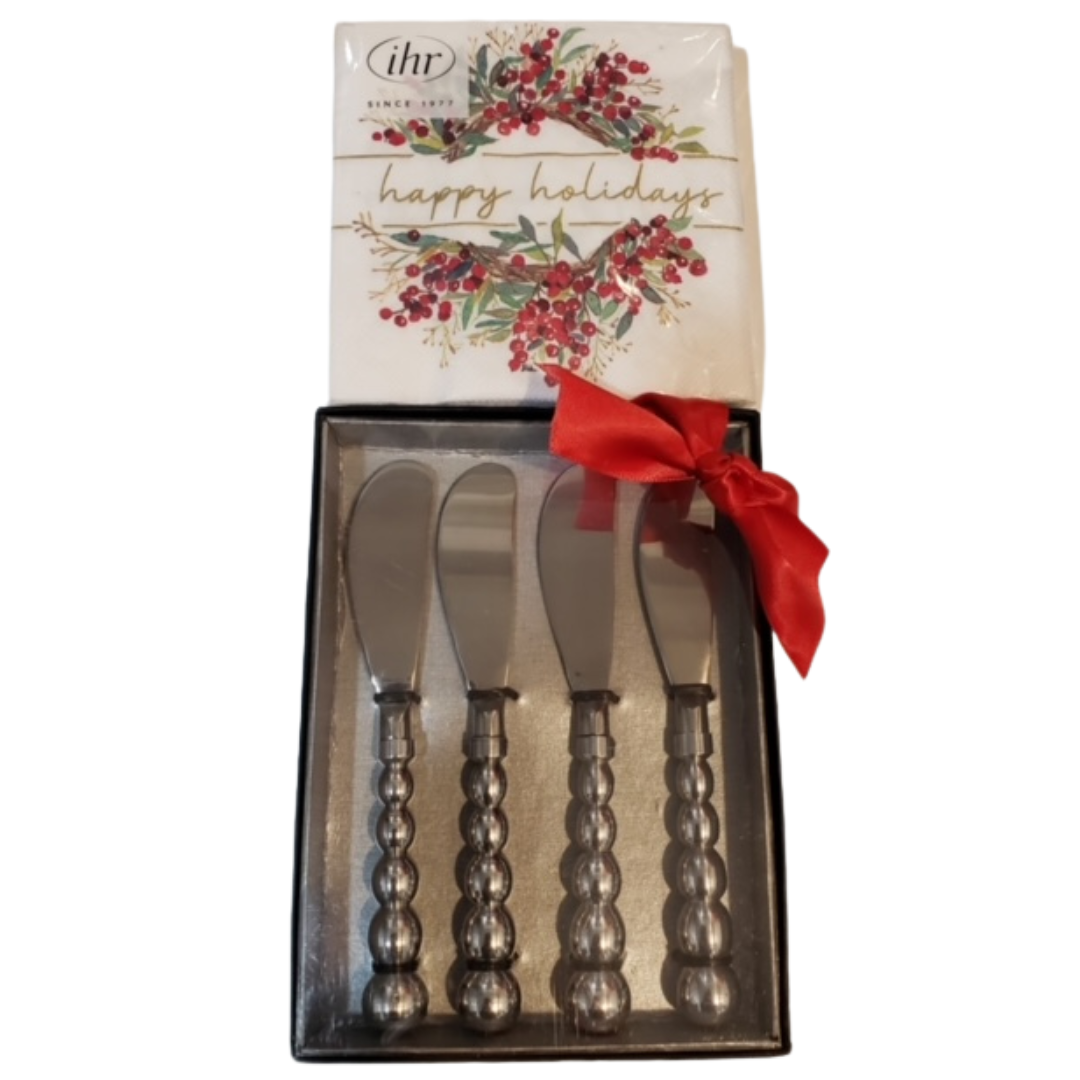 fAppetizer knife set with decorative holiday napkins arranged for entertaining and serving small bites at parties