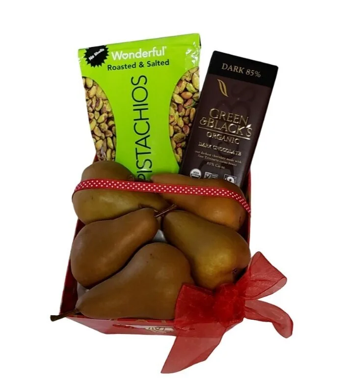 Gift basket with fresh pears, roasted pistachios, and assorted gourmet chocolates arranged in a decorative package