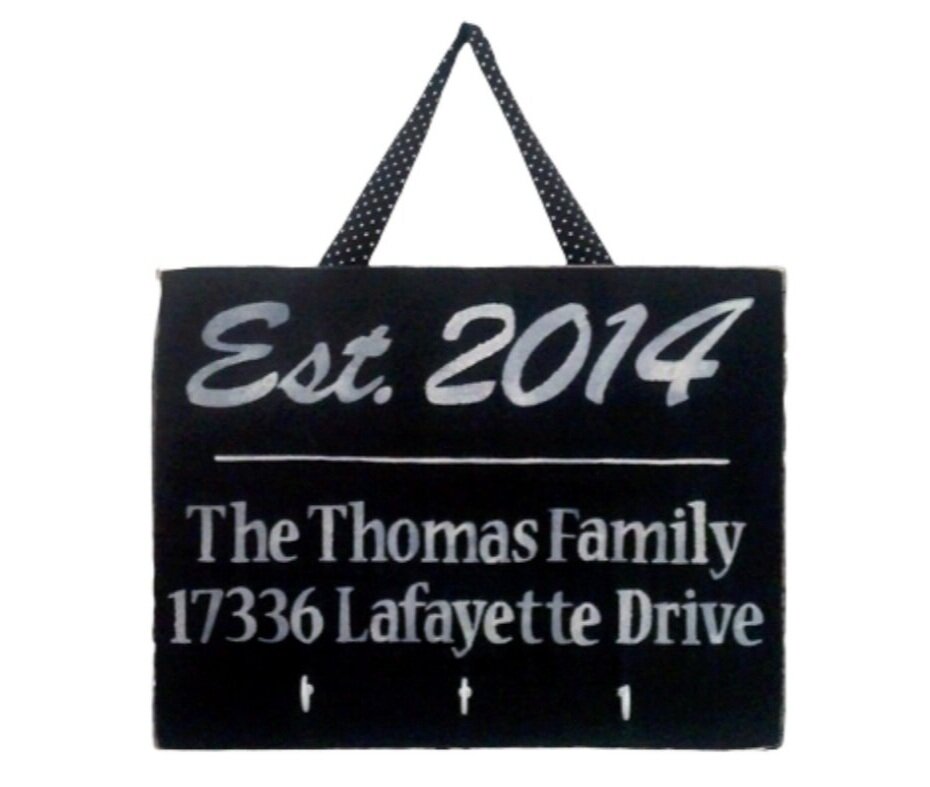 Personalized new home welcome sign displayed as a thoughtful housewarming gift, featuring custom home details and elegant décor for new homeowners.