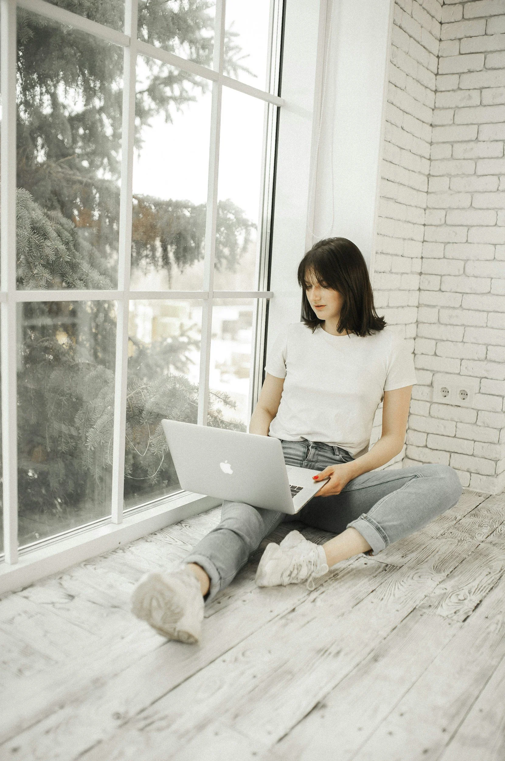 Woman working on a laptop.