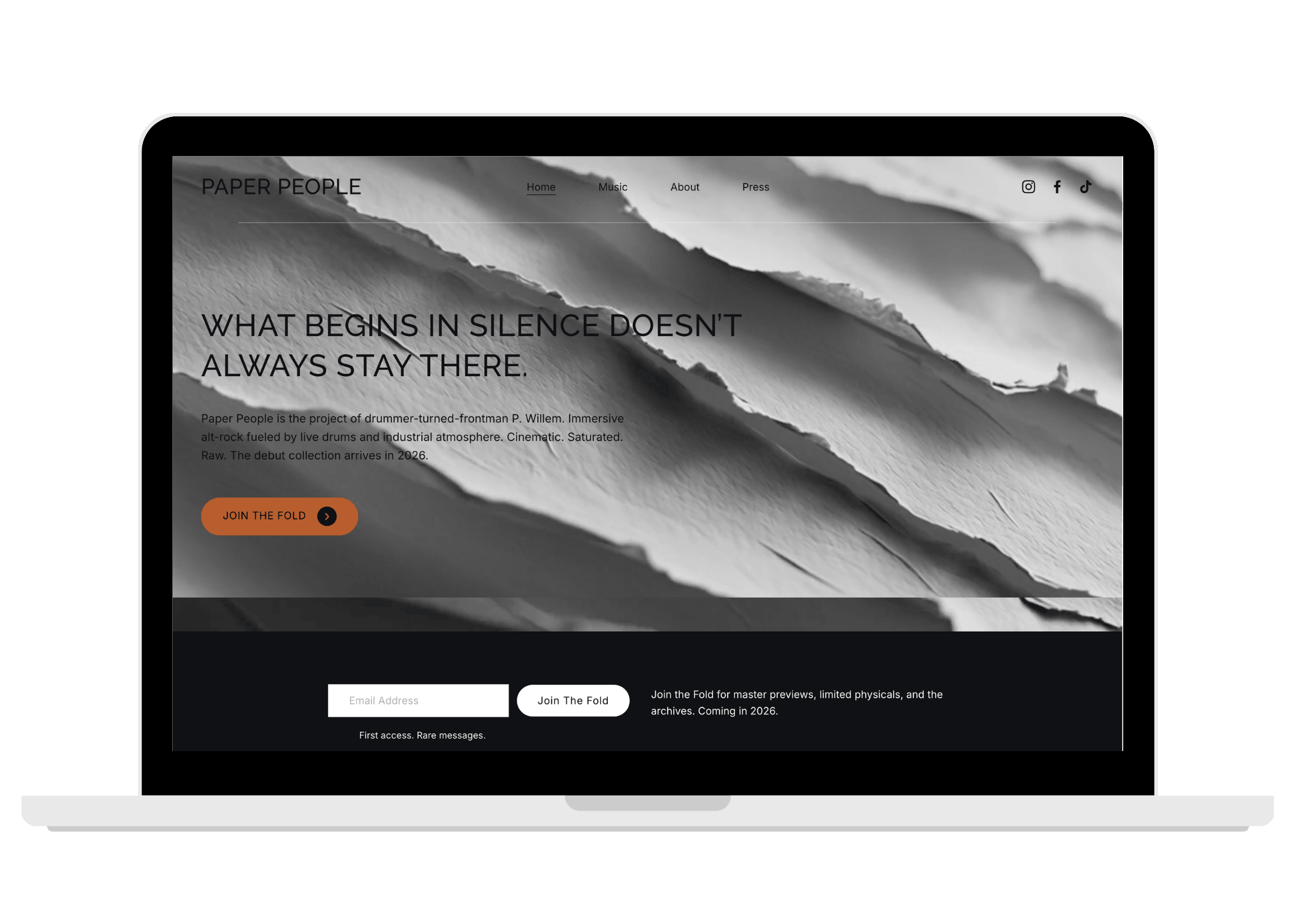 Paper People alt-rock website homepage displayed on a laptop
