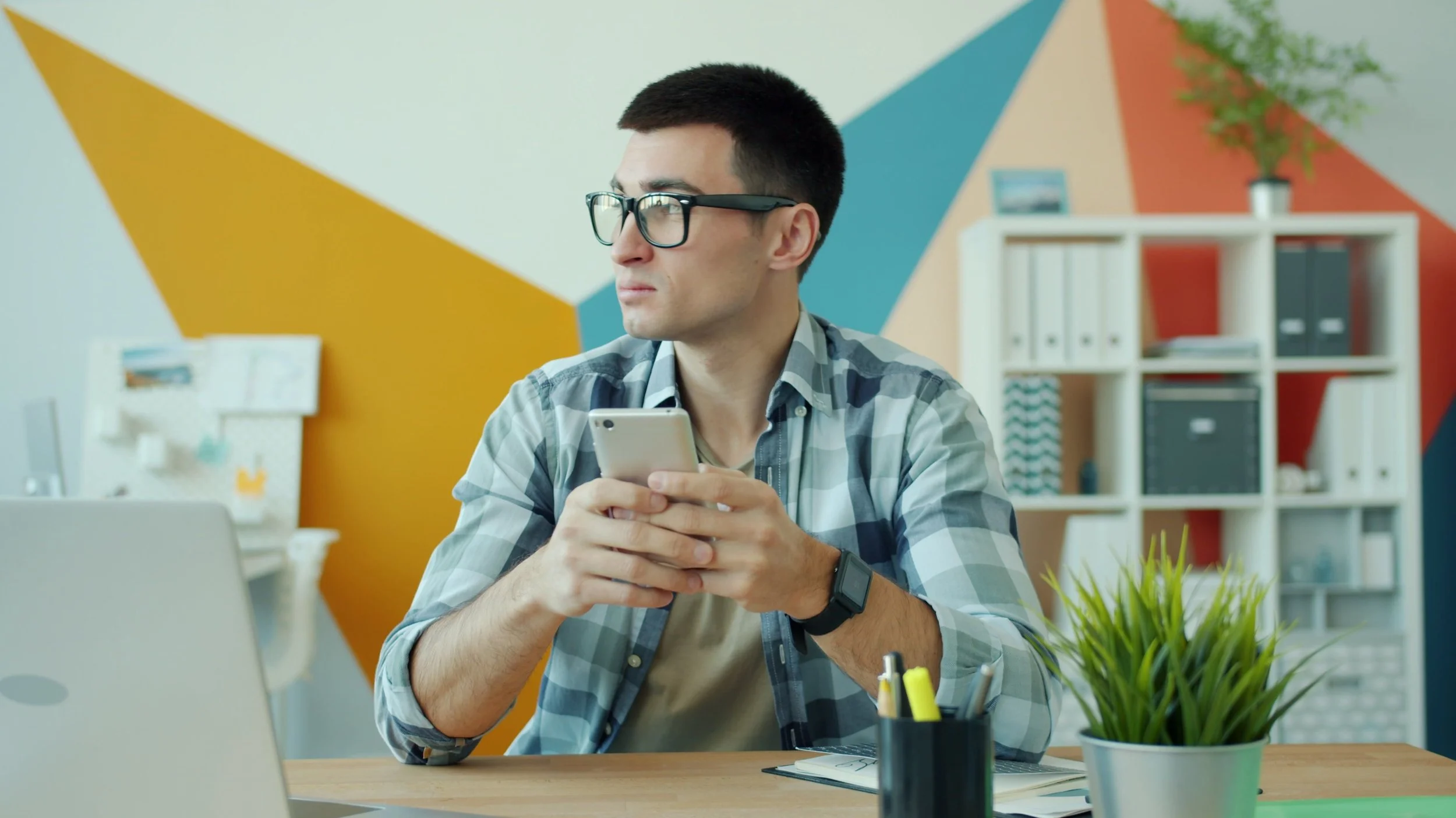 Man viewing a website on his mobile phone, illustrating common website problems.