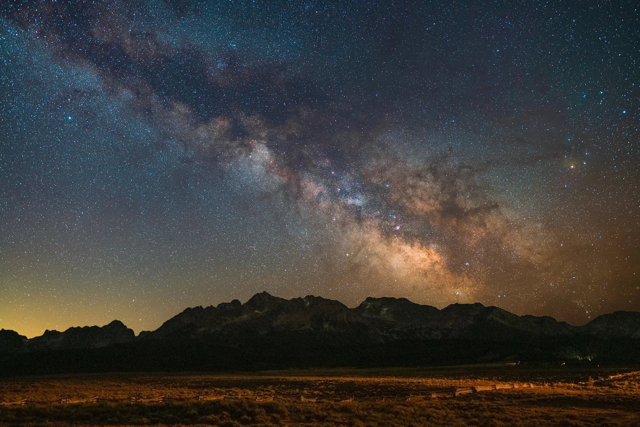 Milky Way galactic core arching over the Sawtooth Mountains near Stanley, Idaho — astrophotography by Kim Starkey