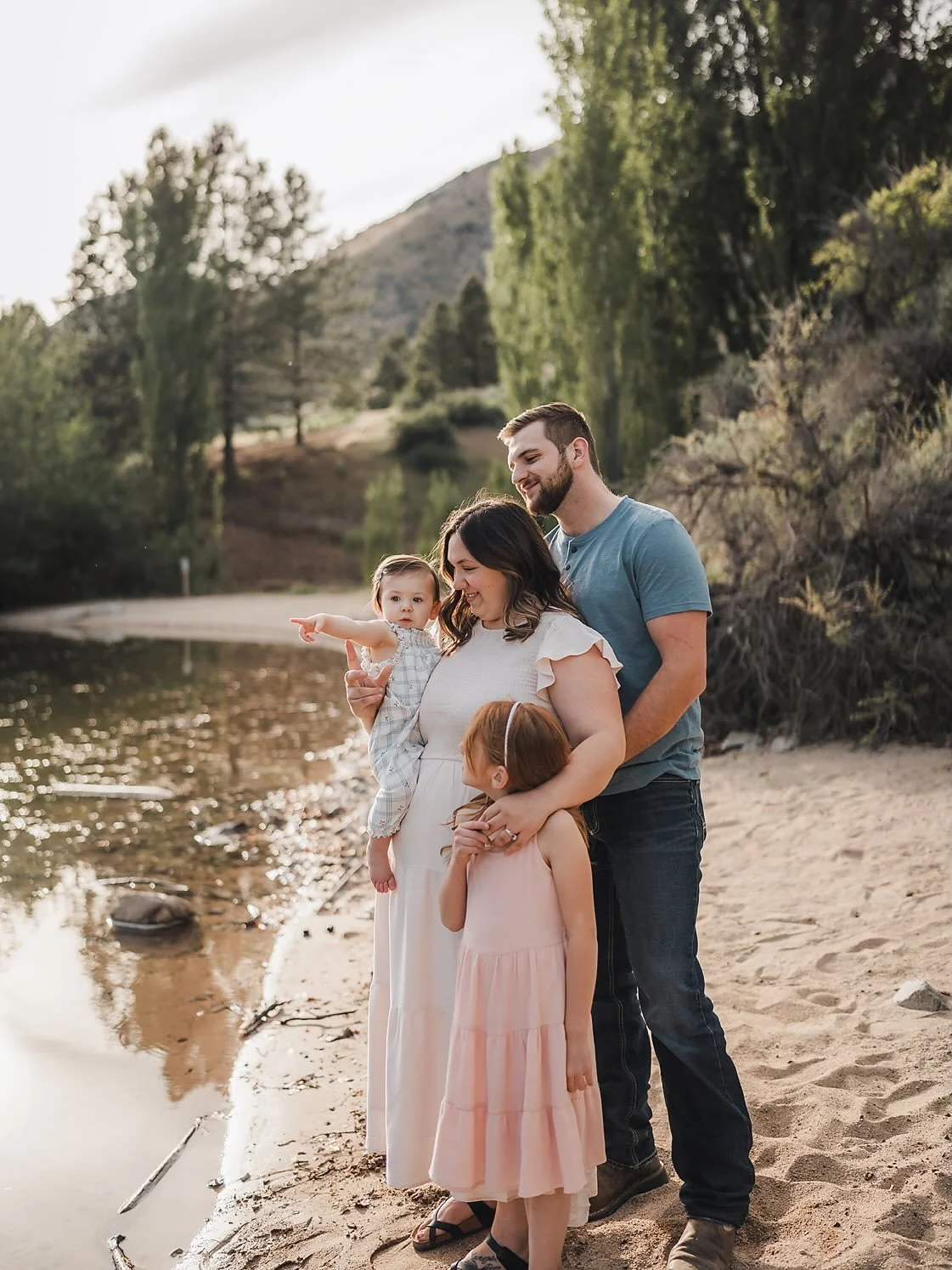Ten years ago, her mom booked a spring motherhood mini. She was the daughter in the frame.
Now I&rsquo;m watching her hold a babe on her hip at the water&rsquo;s edge, her oldest twirling in pink behind her, and it hits me every single time &mdash; t