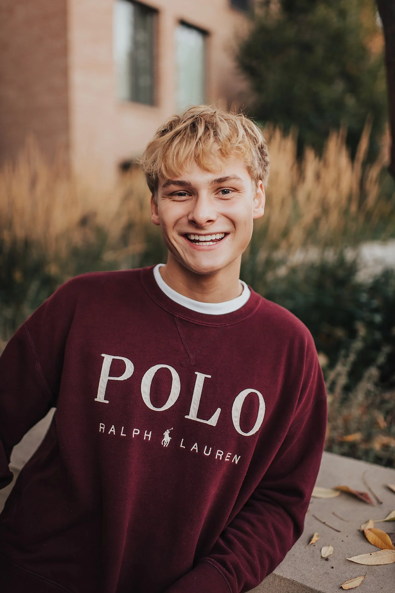 High school senior smiling naturally during a laid-back North End senior session in Boise, Idaho.