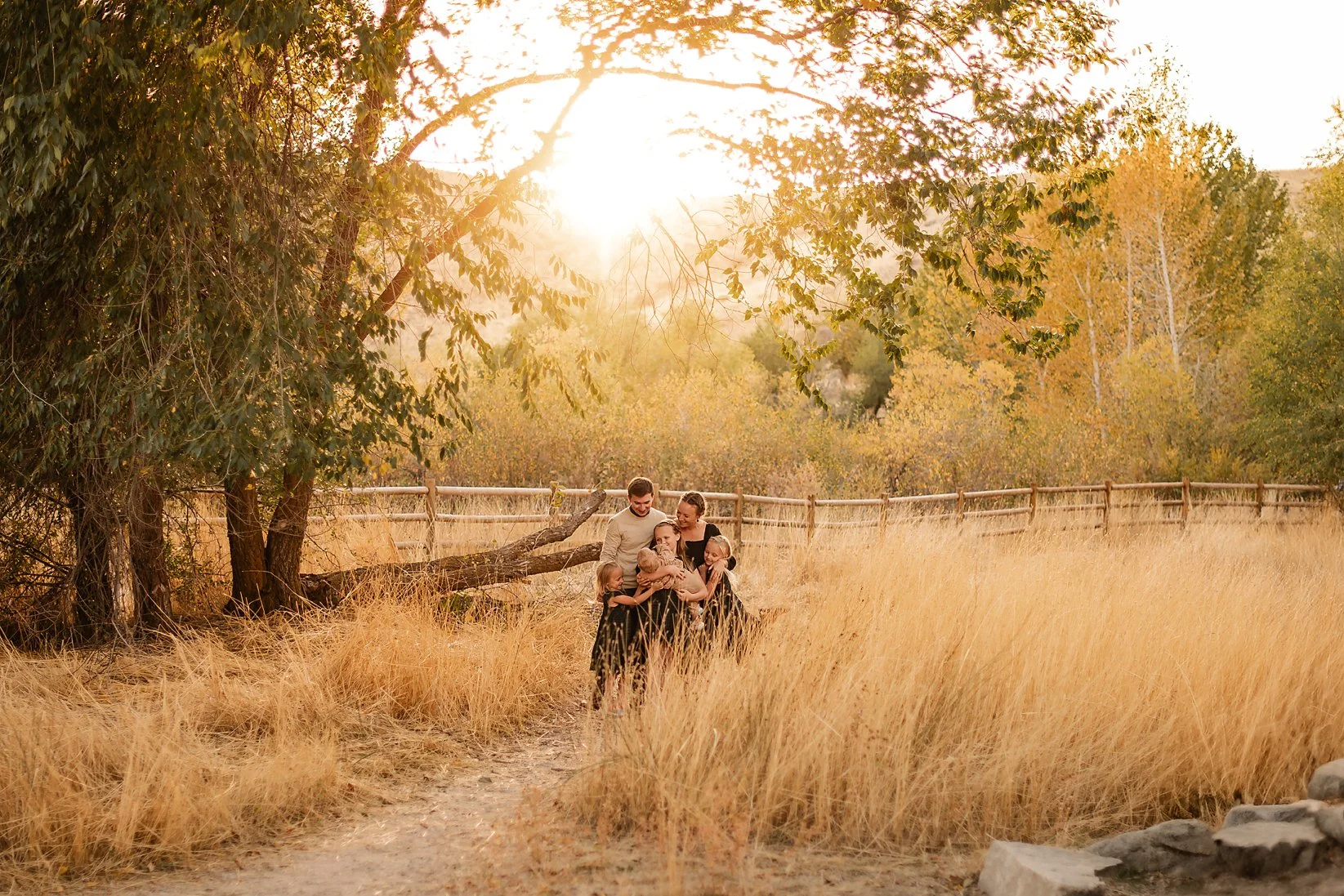 Family of six together in the Boise foothills at golden hour