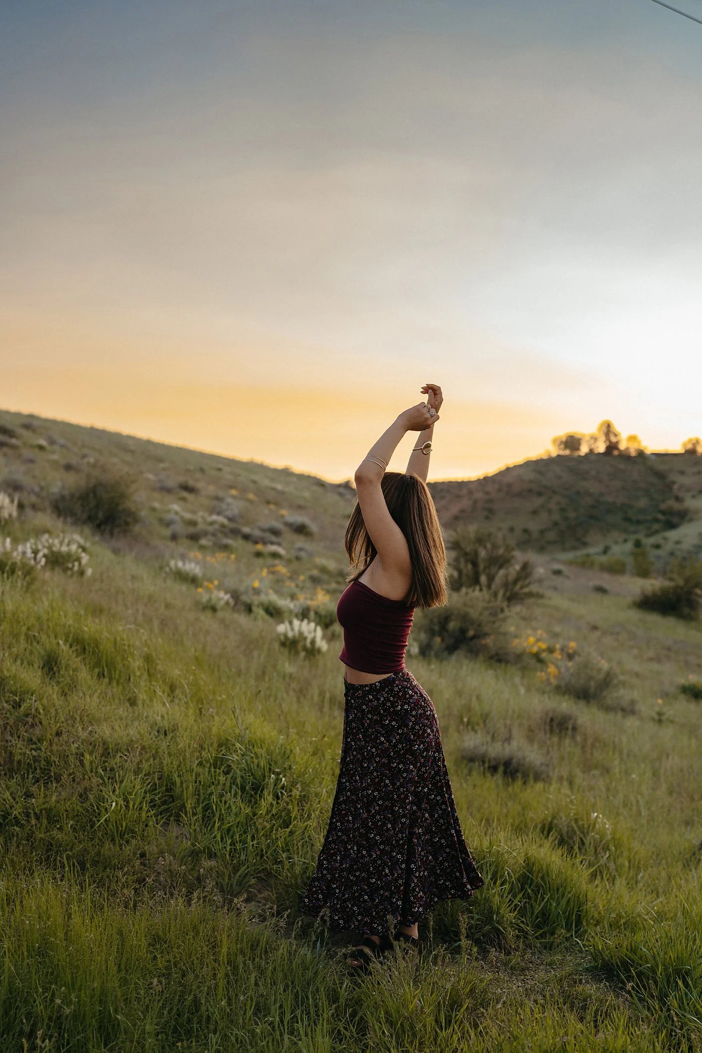 Boise high school senior portrait in fall golden light with off shoulder black top and embroidered jeans in Idaho.