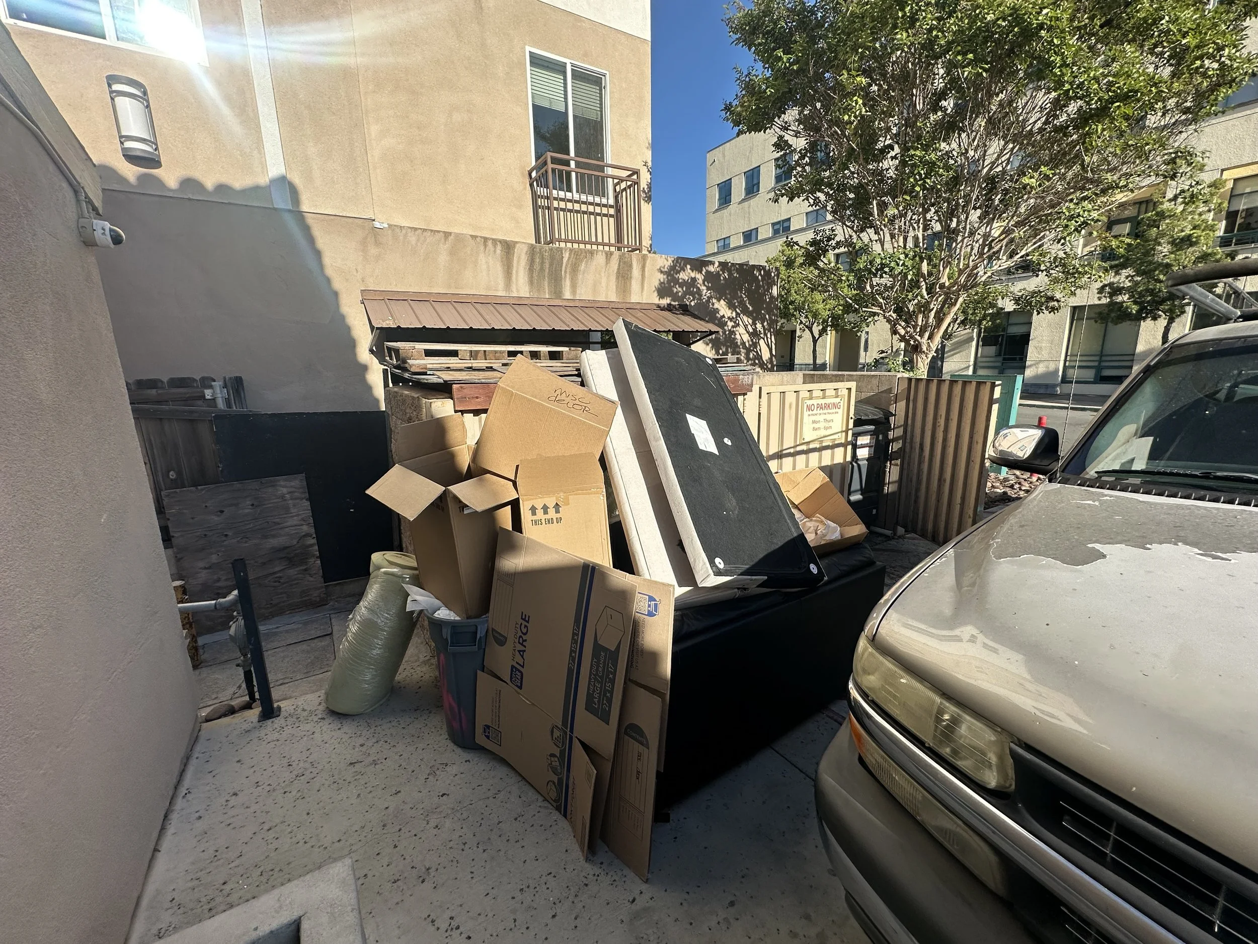Another overflowing dumpster. A tenant within the community left their furniture at the dumpster.