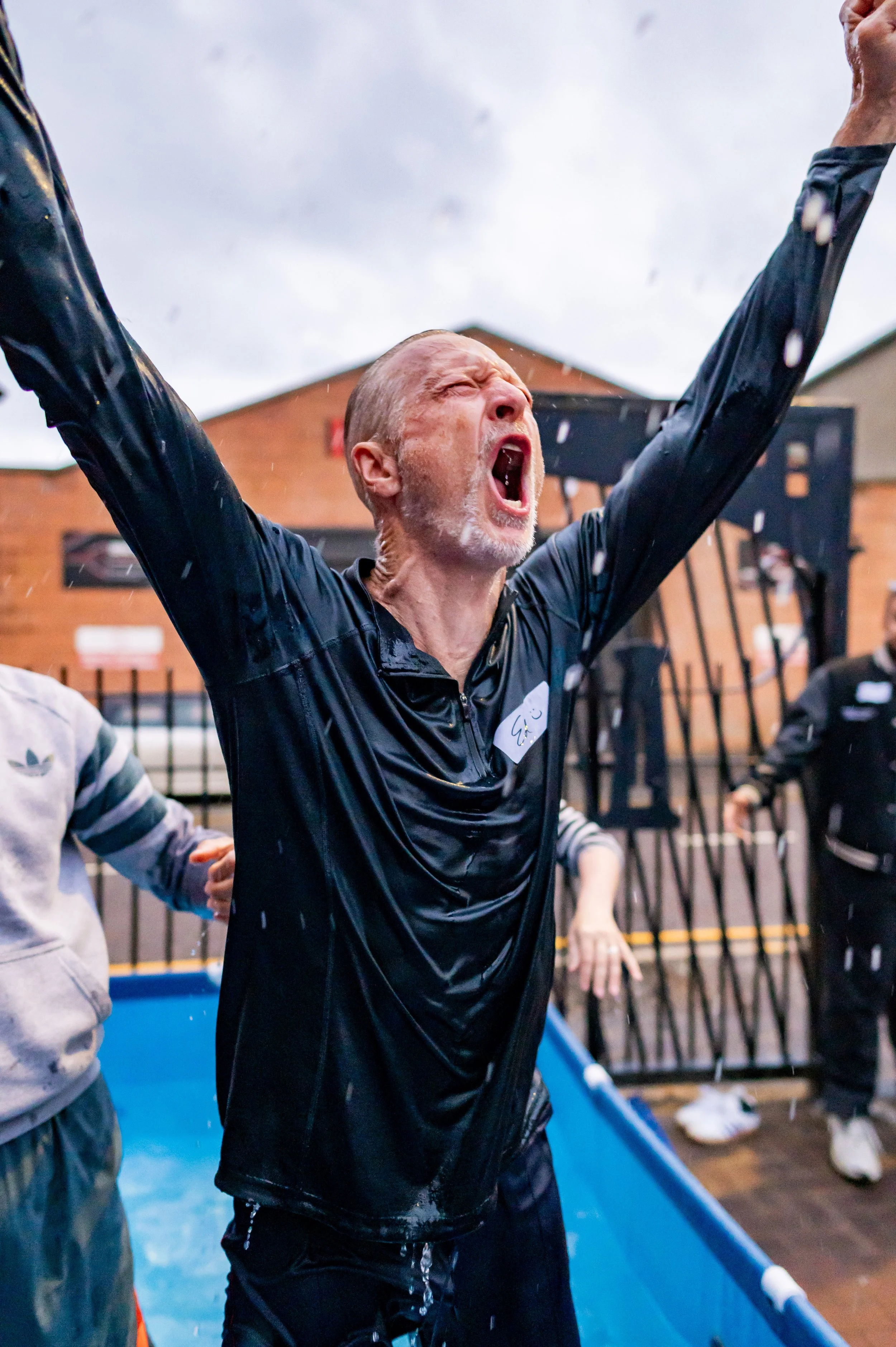 A man cheering after he has been baptized.