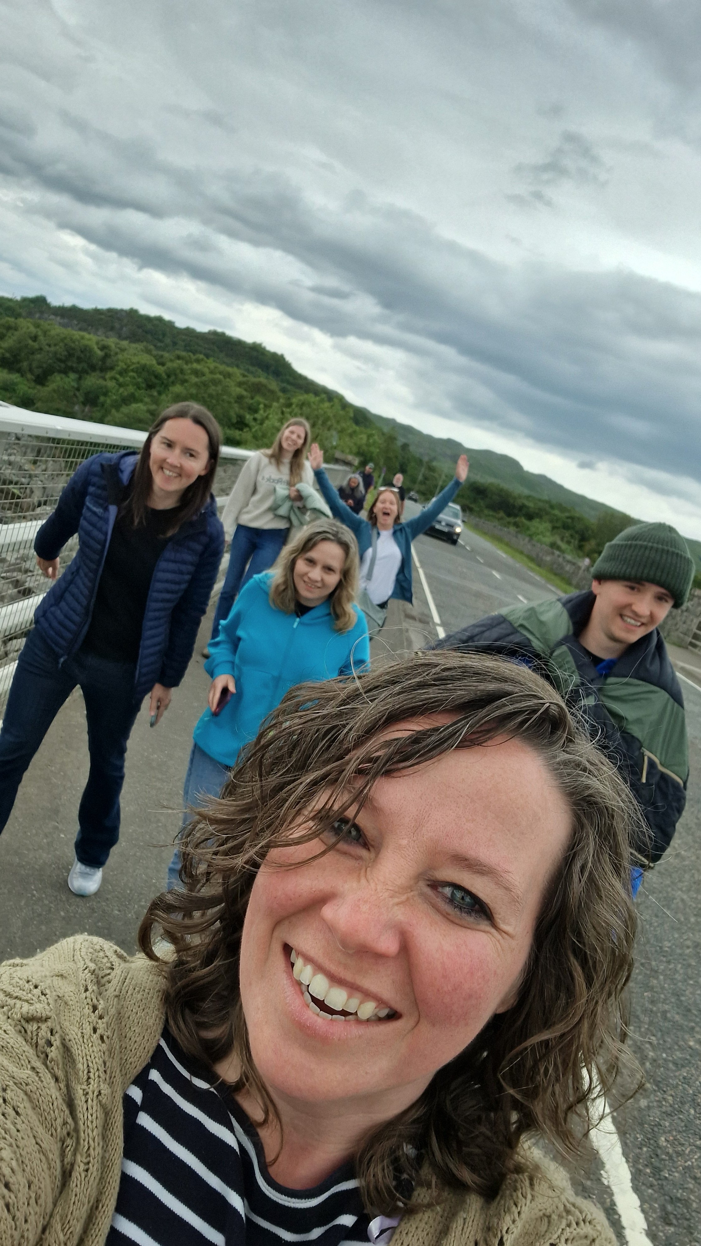 A group of people walking, selfie angle.