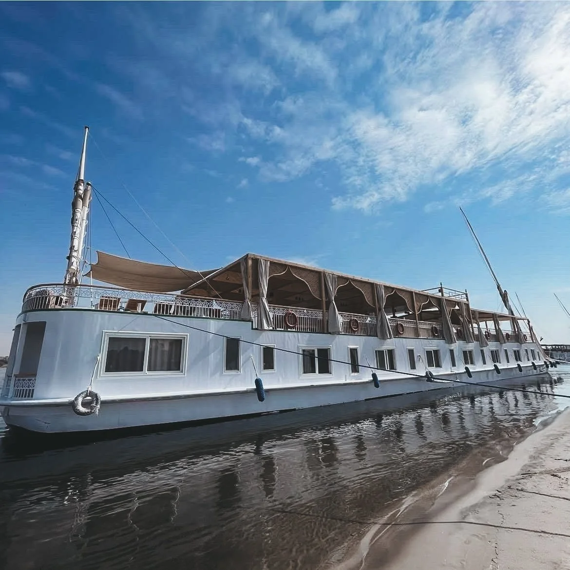Private Dahabiya on the Nile serving as a floating sanctuary for ceremony and spiritual immersion in Egypt.
