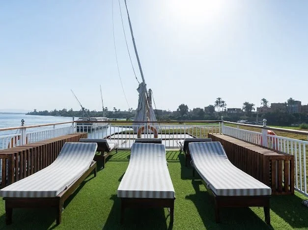Upper deck with sun lounge chairs on the dahabiya